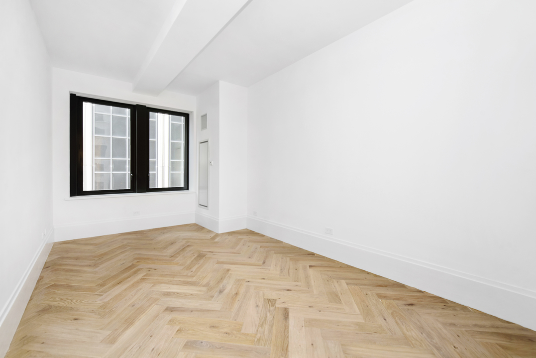 101 Wall Street, Unit 12C Manhattan, NY 10005 - Photo 7 of 18 a view of empty room with window
