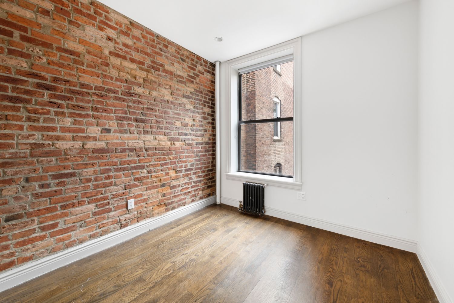 51 West 11th Street, Unit 3R Manhattan, NY 10011 - Photo 4 of 5 a view of an empty room with a window