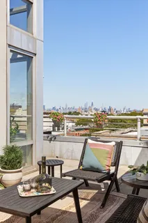 a view of a swimming pool with lounge chairs