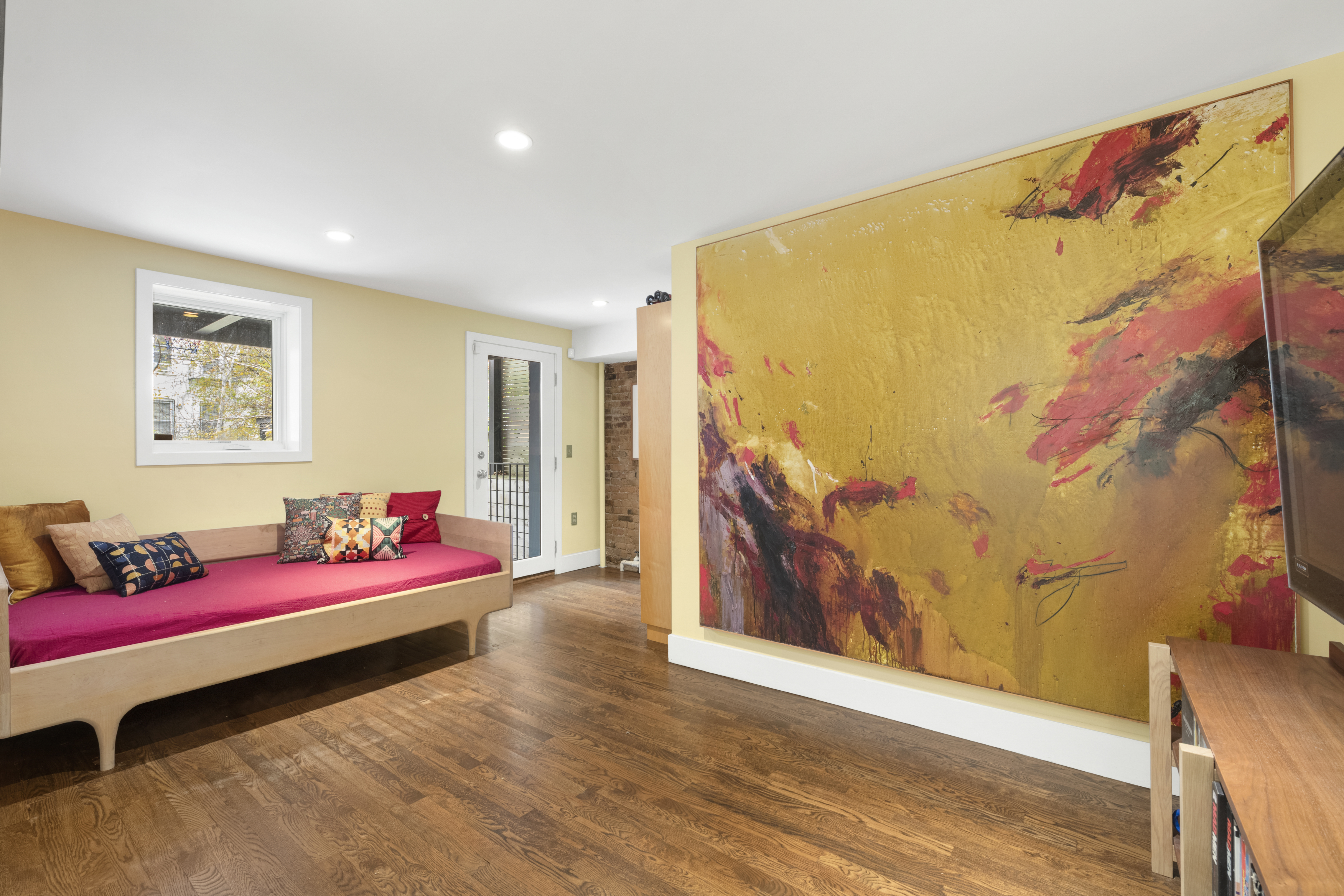 203 Huntington Street Brooklyn, NY 11231 - Photo 7 of 16 a bedroom with a bed and wooden floor