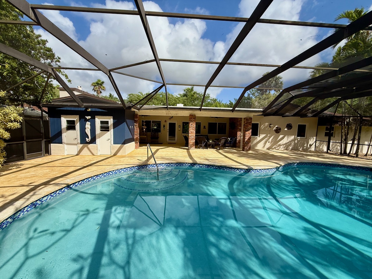 7555 Southwest 79th Avenue Miami, FL 33143 - Photo 5 of 8 a view of a swimming pool with a patio