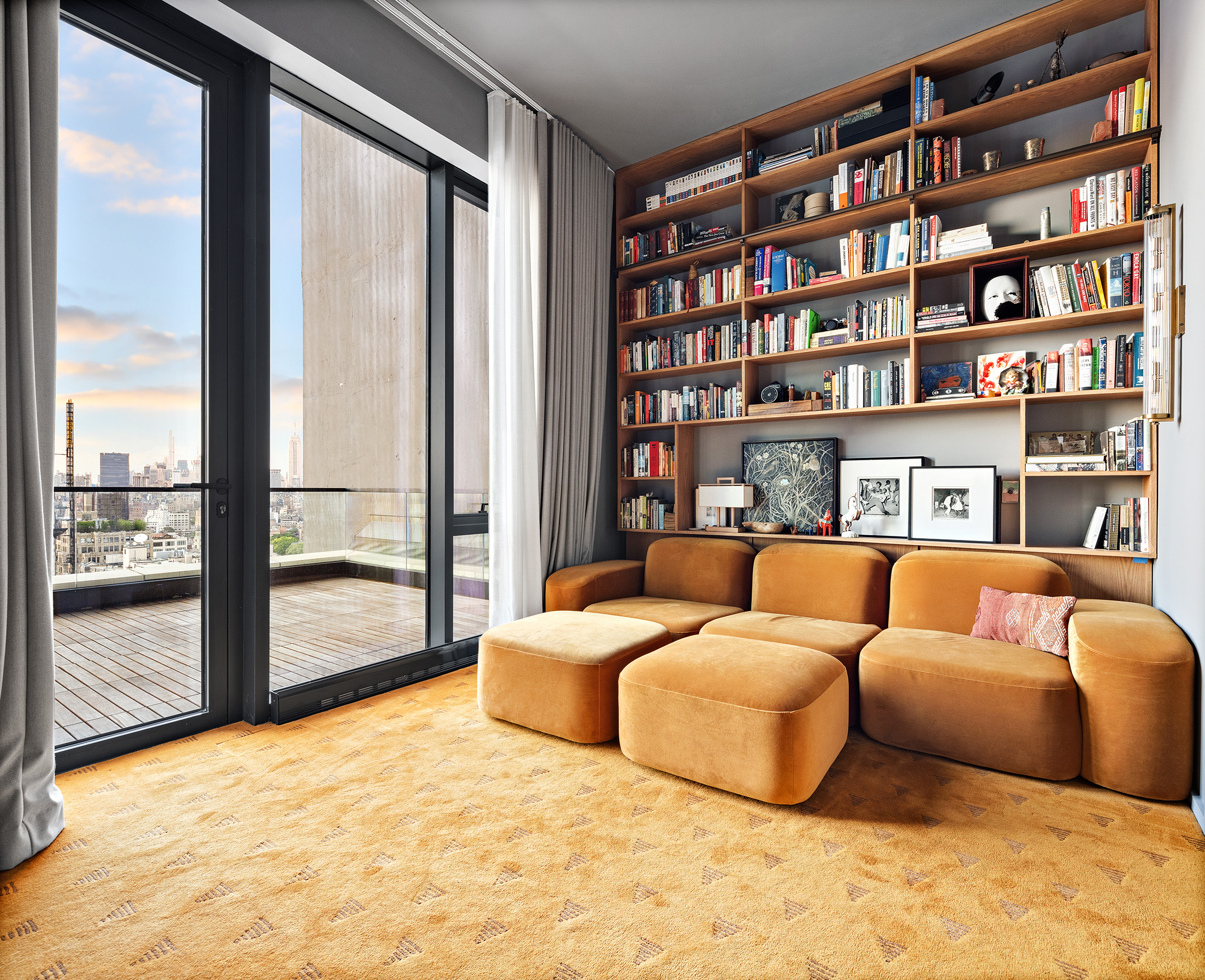570 Broome Street, Unit PHA Manhattan, NY 10013 - Photo 14 of 22 a bedroom with furniture and a book shelf