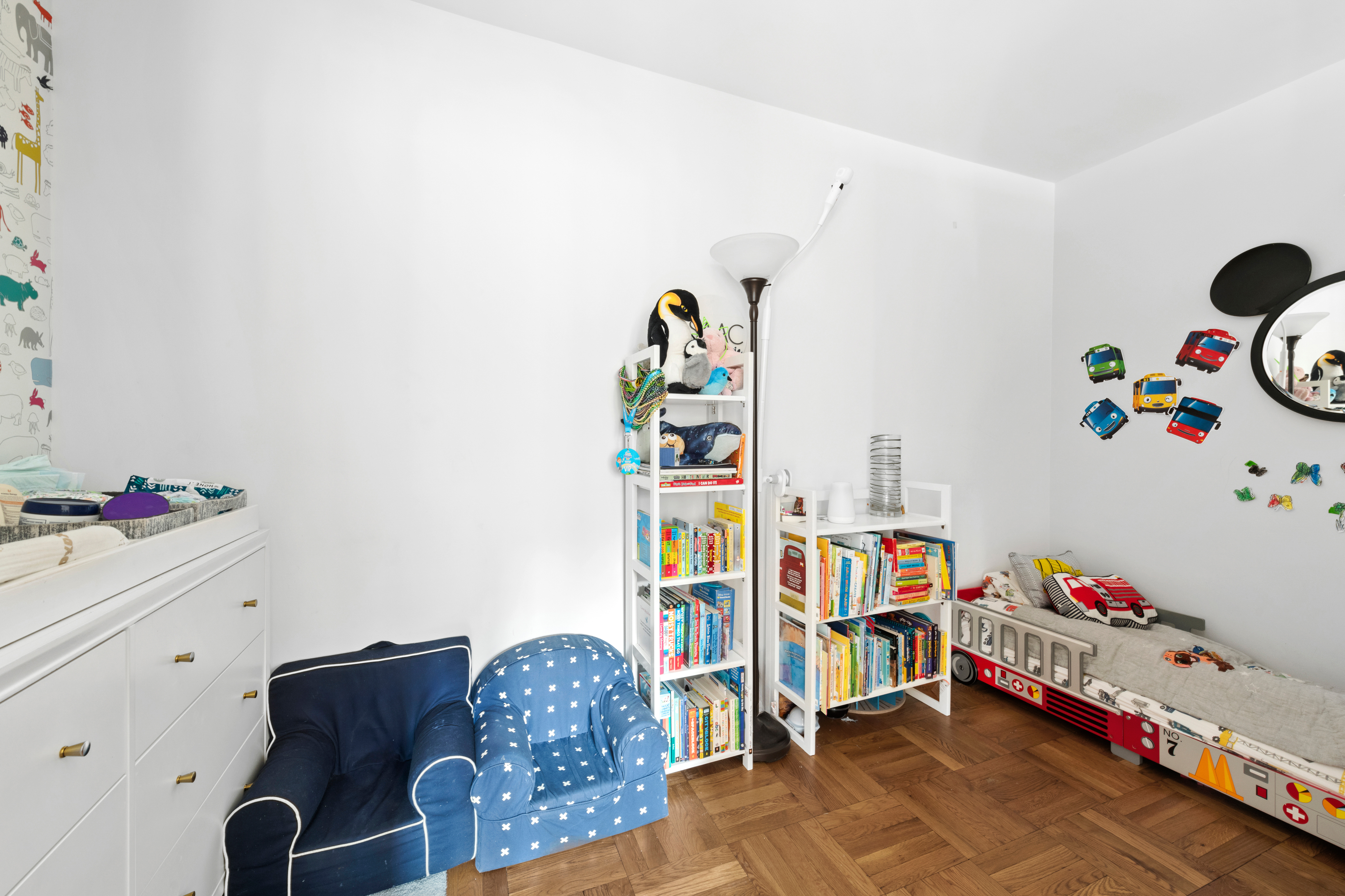 315 East 72nd Street, Unit 15M Manhattan, NY 10021 - Photo 13 of 18 a bedroom with baby toys and dresser