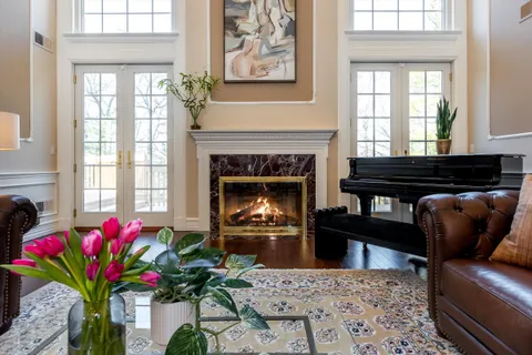 a living room with furniture fireplace and window