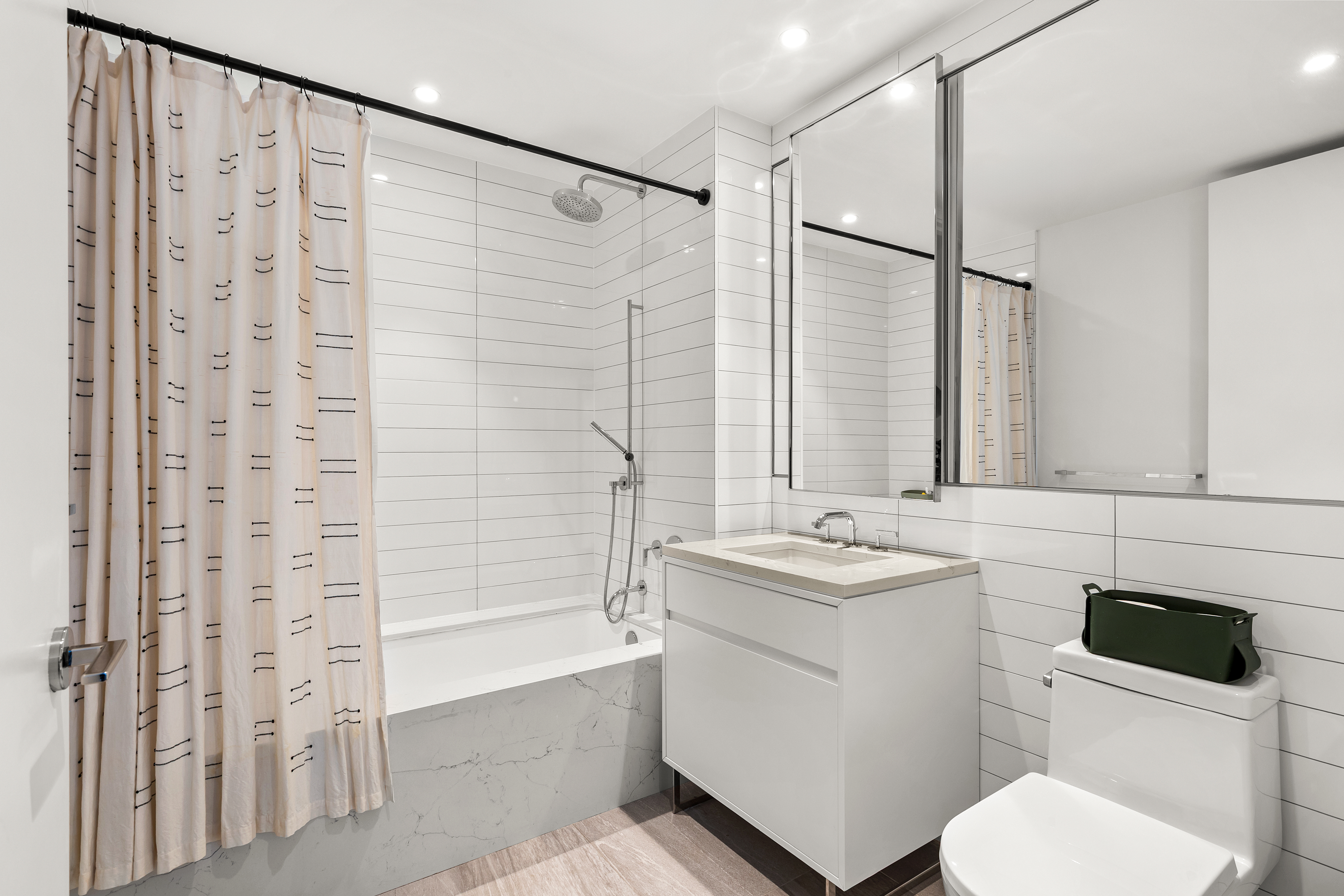 150 East 23rd Street, Unit 3C Manhattan, NY 10010 - Photo 8 of 12 a bathroom with a sink toilet and shower