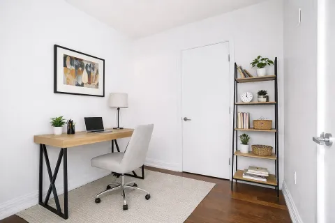a view of a workspace with furniture