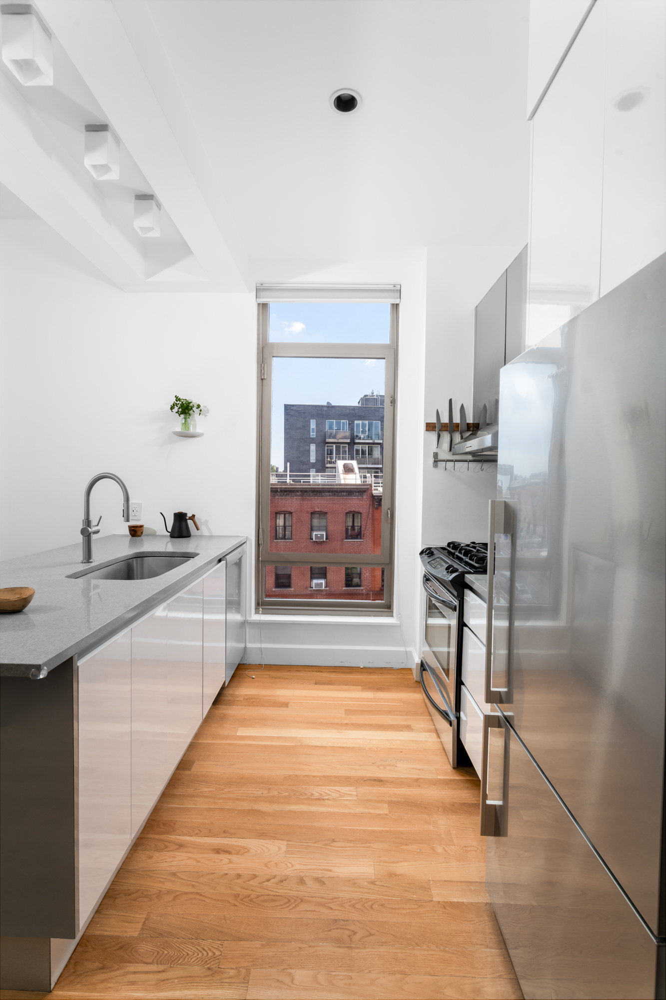 315 Gates Avenue, Unit 4E Brooklyn, NY 11216 - Photo 6 of 17 a large spacious bathroom with a tub and mirror