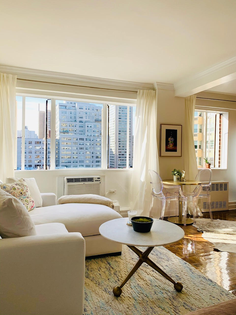 510 East 85th Street, Unit 11A6 Manhattan, NY 10028 - Photo 1 of 8 a living room with furniture and a large window