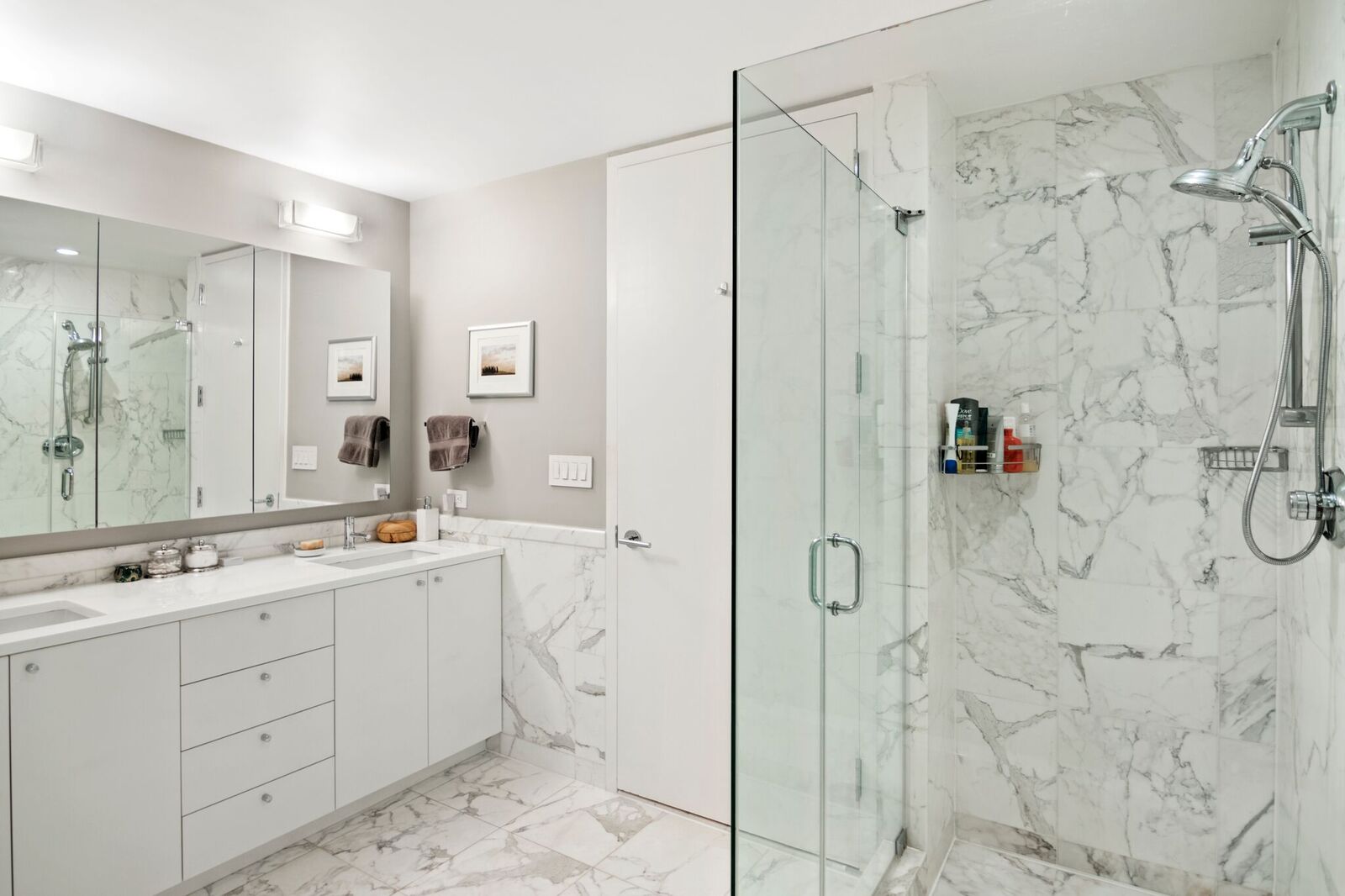 224 West 18th Street, Unit 6C Manhattan, NY 10011 - Photo 10 of 21 a bathroom with a double sink shower and a mirror