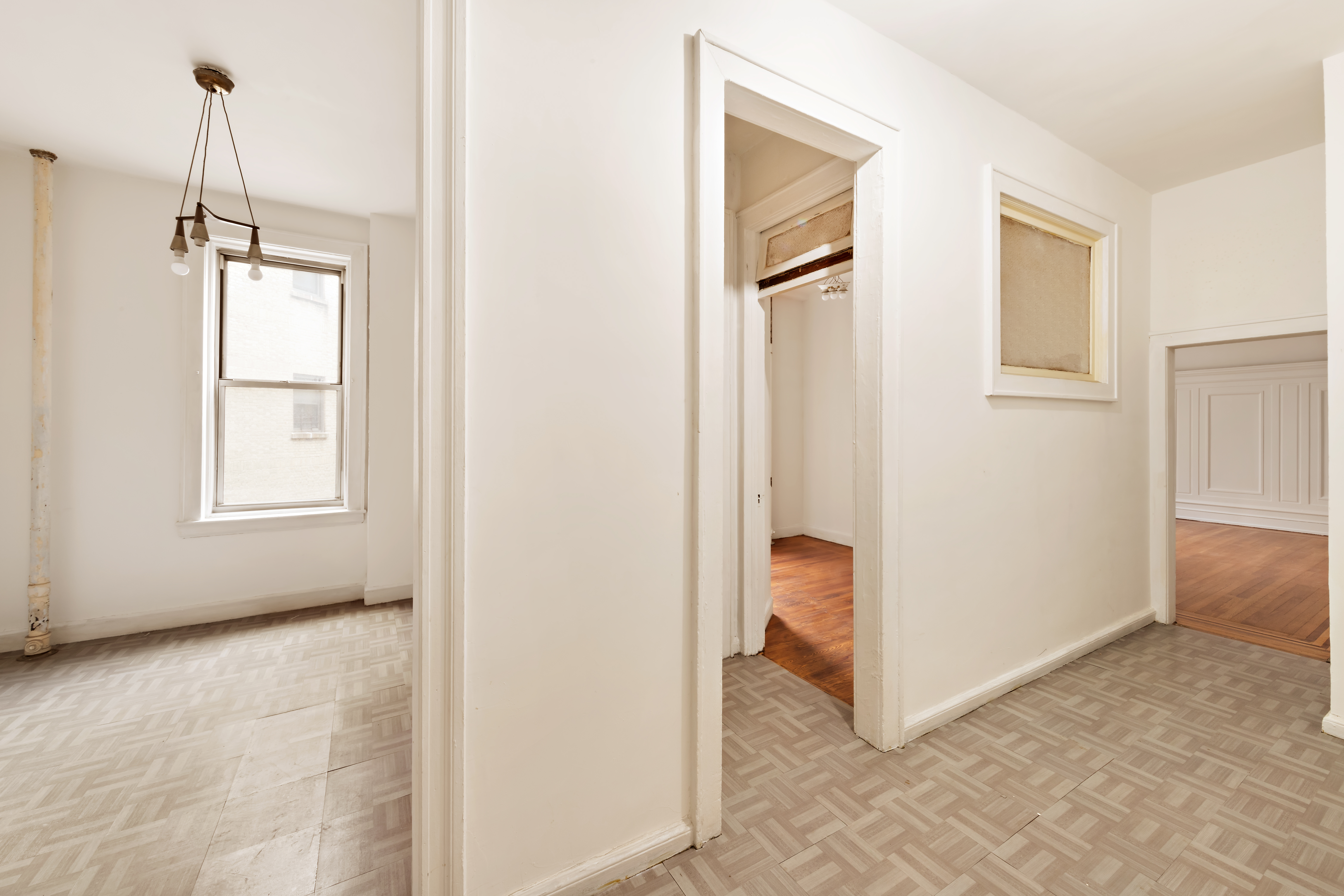 800 Riverside Drive, Unit 6E Manhattan, NY 10032 - Photo 13 of 30 a view of an empty room with window and hallway