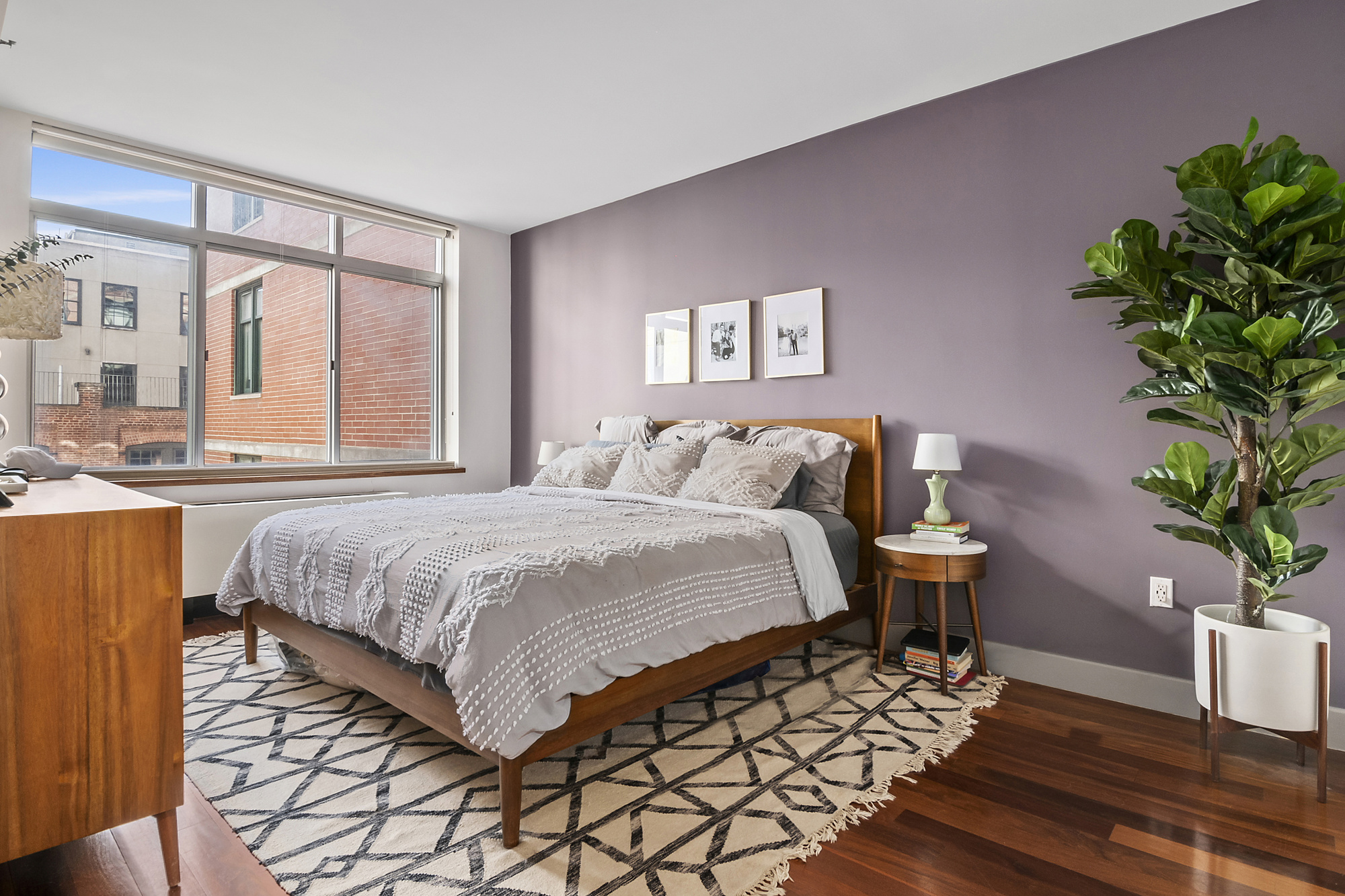 84 Front Street, Unit 7F Brooklyn, NY 11201 - Photo 4 of 12 a spacious bedroom with a bed and a potted plant