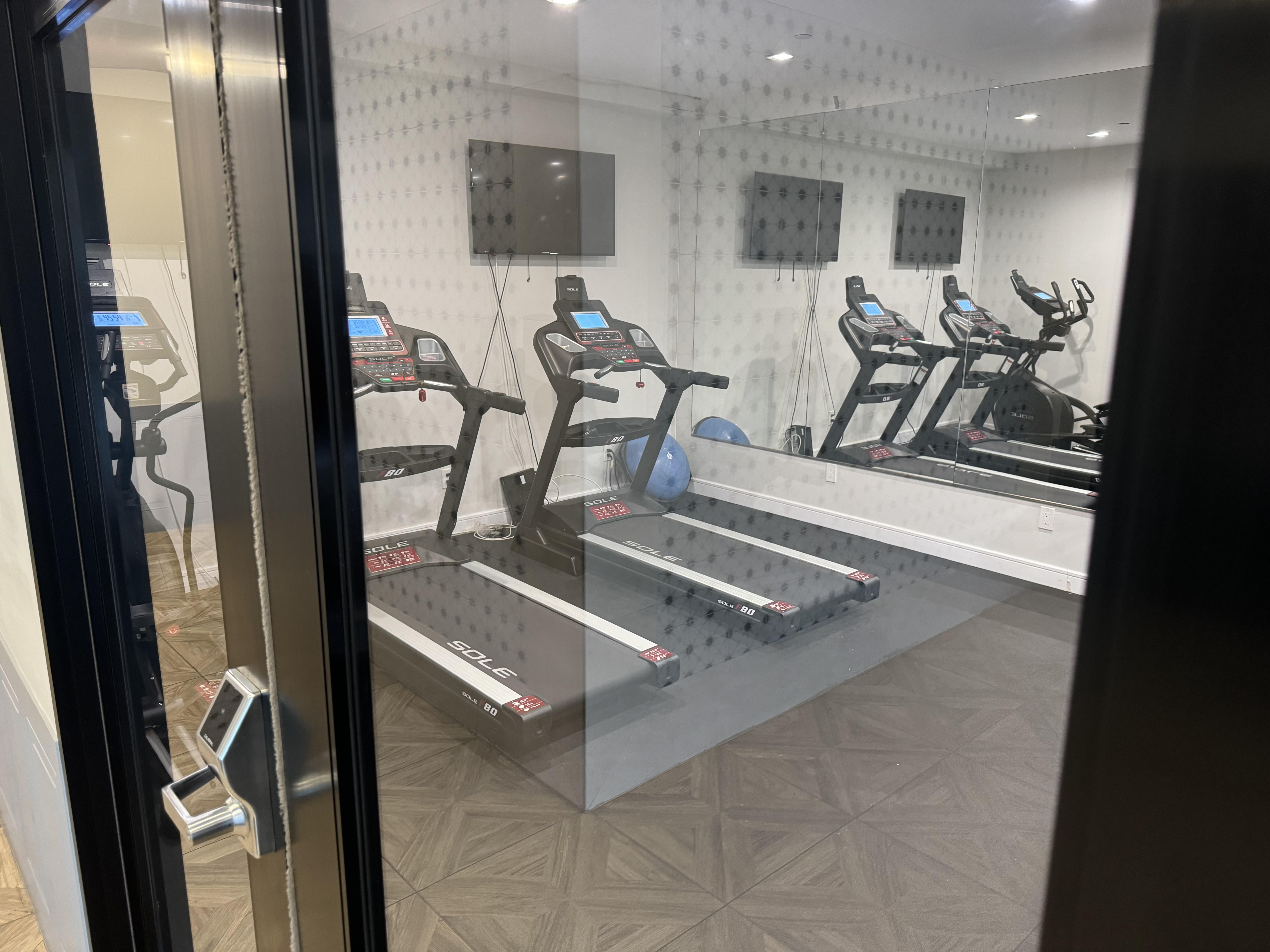 1229 Putnam Avenue, Unit 2D Brooklyn, NY 11221 - Photo 7 of 9 a view of a room with gym equipment