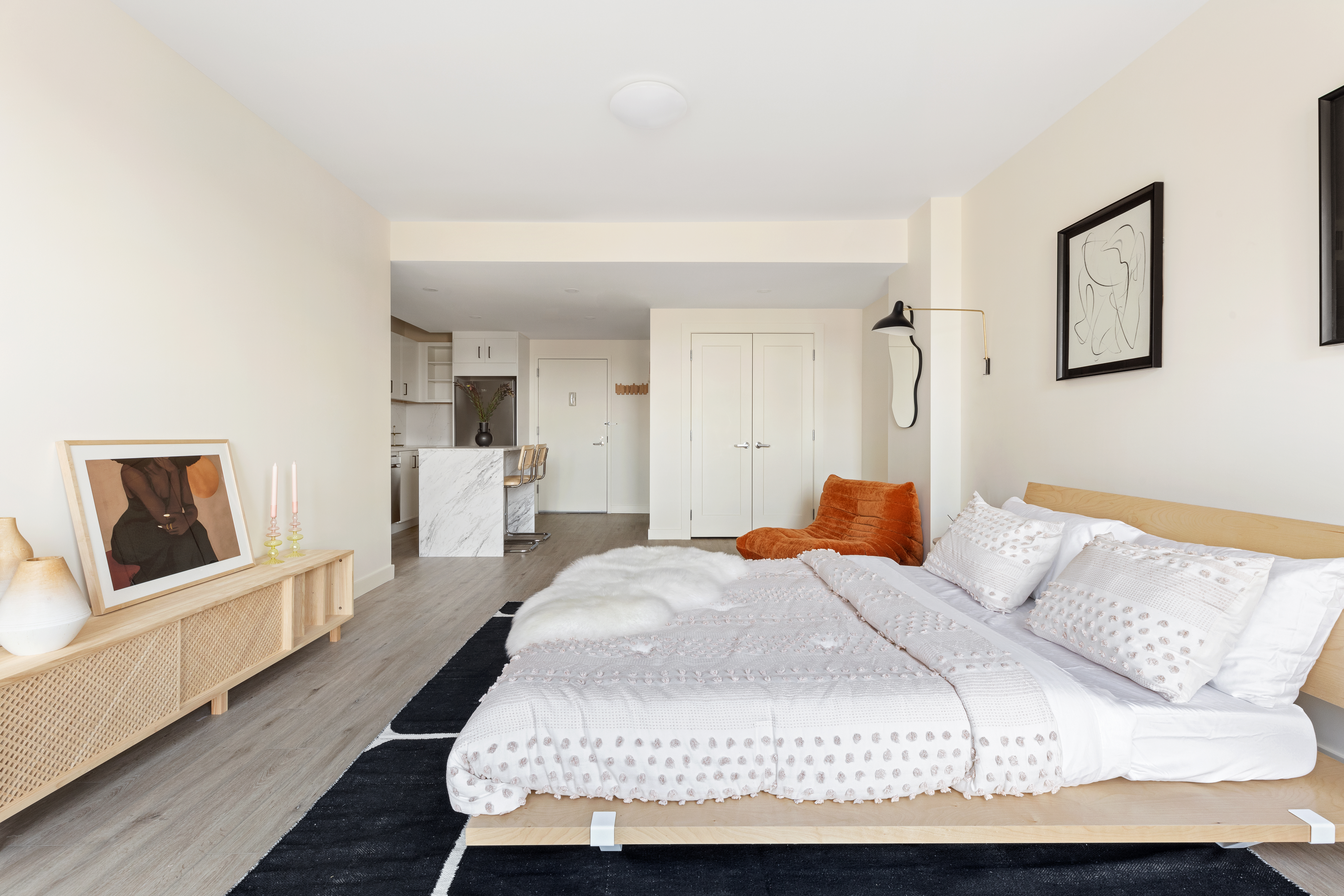 130 East 177th Street, Unit 8A Bronx, NY 10453 - Photo 3 of 16 a bedroom with a bed wooden floor and window