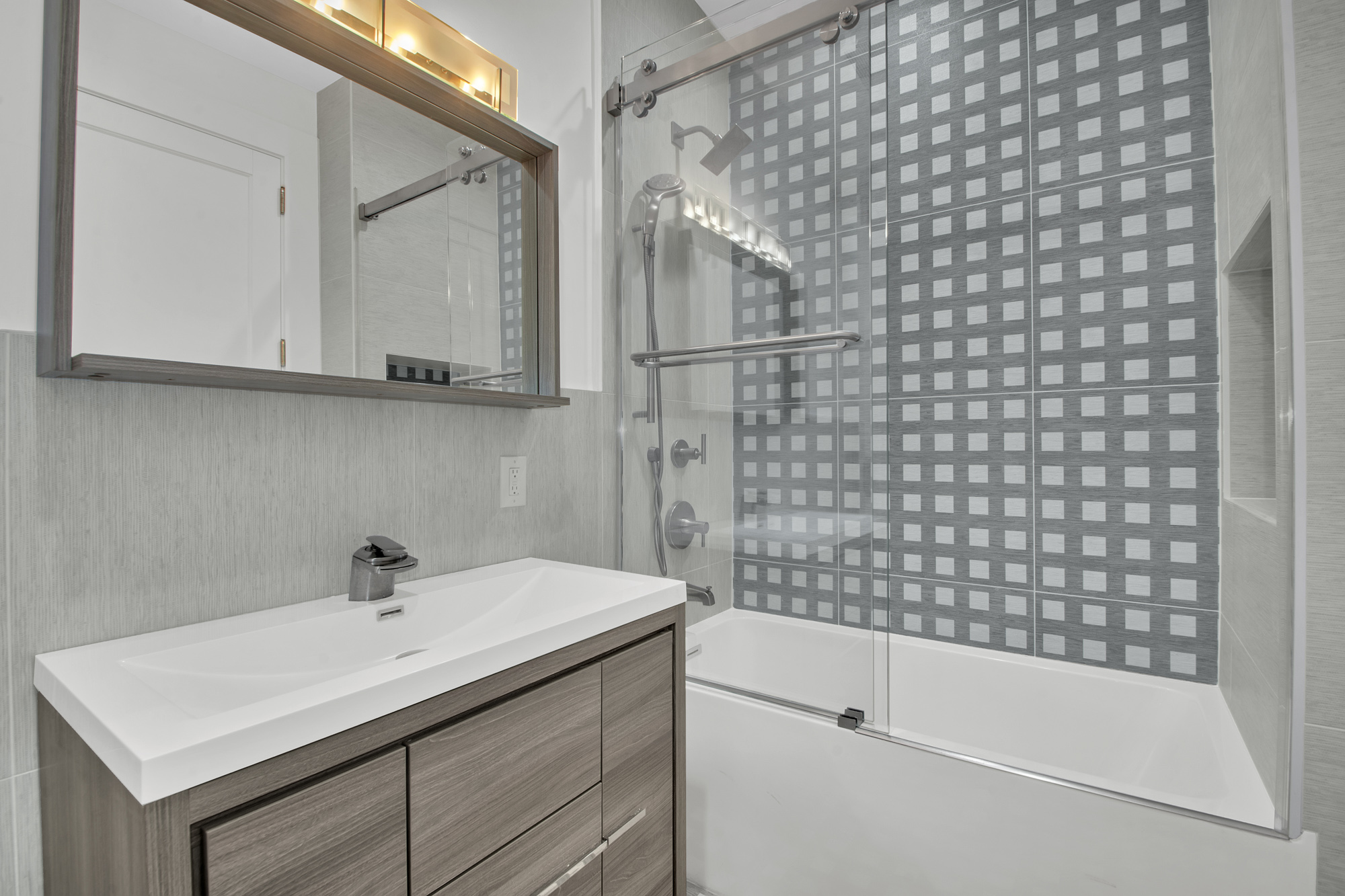 208 West 122nd Street Manhattan, NY 10027 - Photo 11 of 22 a bathroom with a sink a toilet and shower