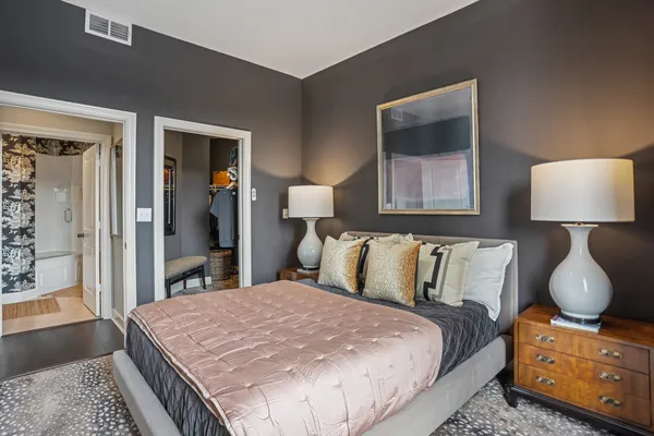 a bedroom with a bed and window