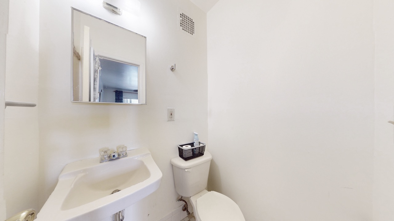 495 Central Avenue, Unit 2 Brooklyn, NY 11221 - Photo 10 of 19 a white toilet sitting next to a bathroom sink