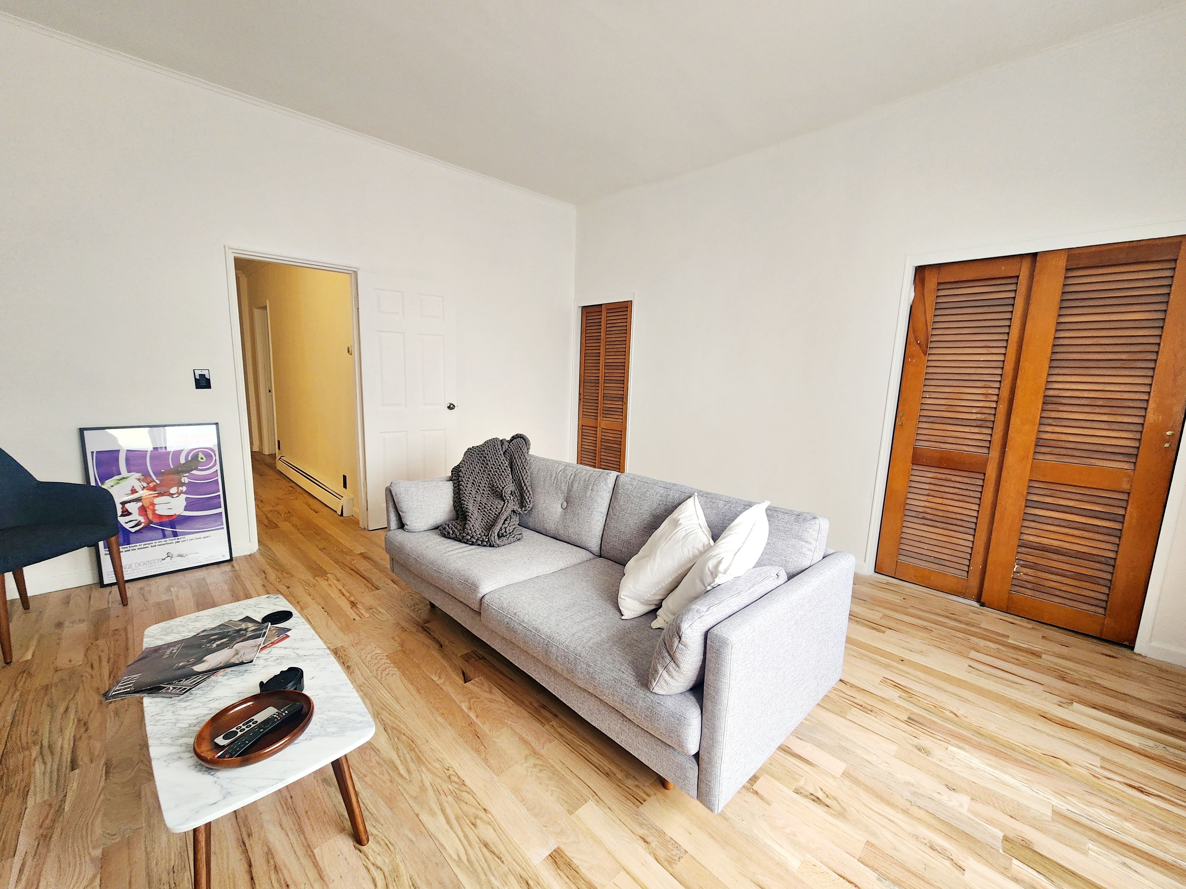258 Devoe Street, Unit 1 Brooklyn, NY 11211 - Photo 11 of 12 a living room with furniture and wooden floor