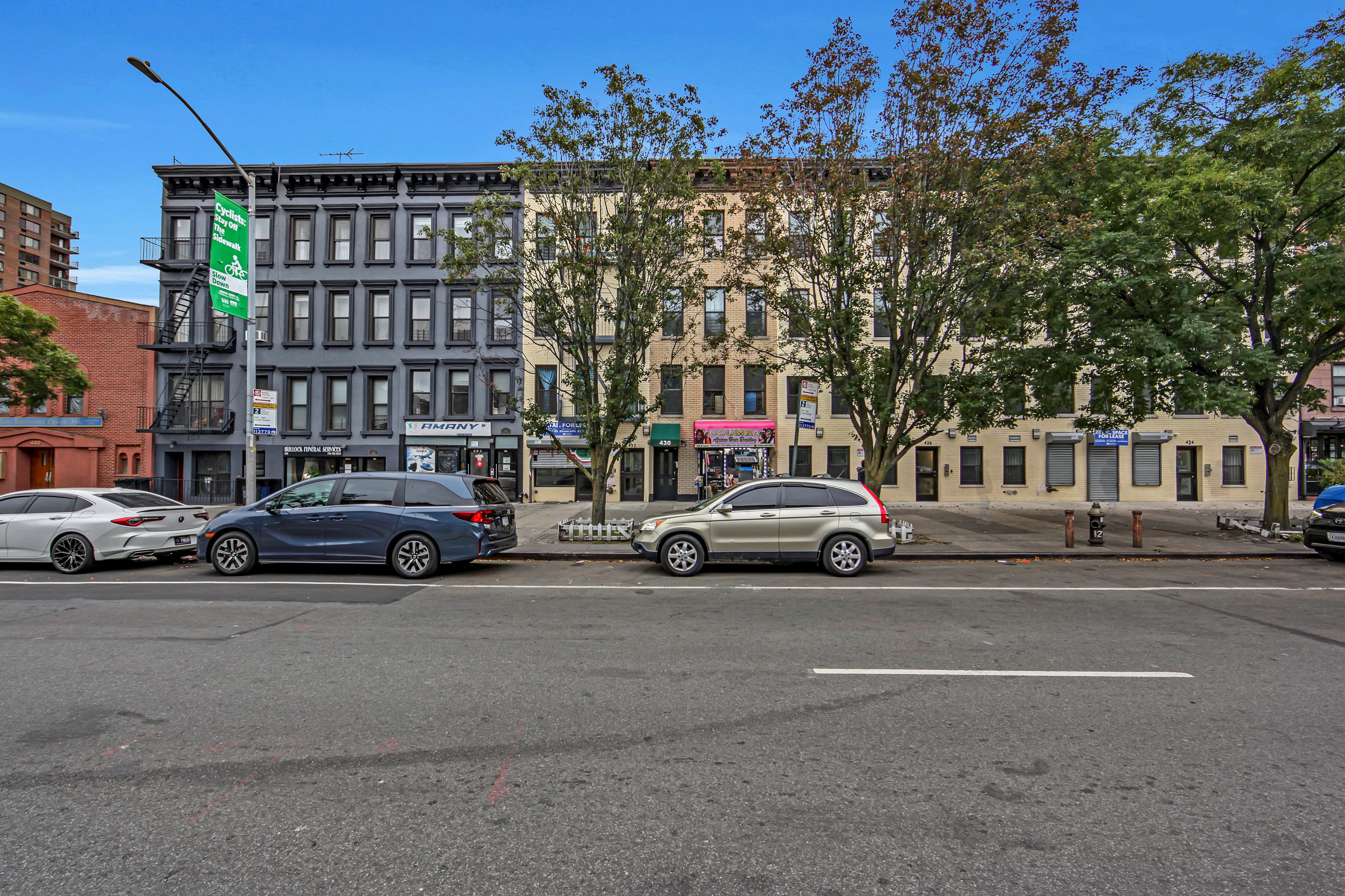 430 Lenox Avenue, Unit 1 Manhattan, NY 10037 - Photo 12 of 14 a car parked in front of a building