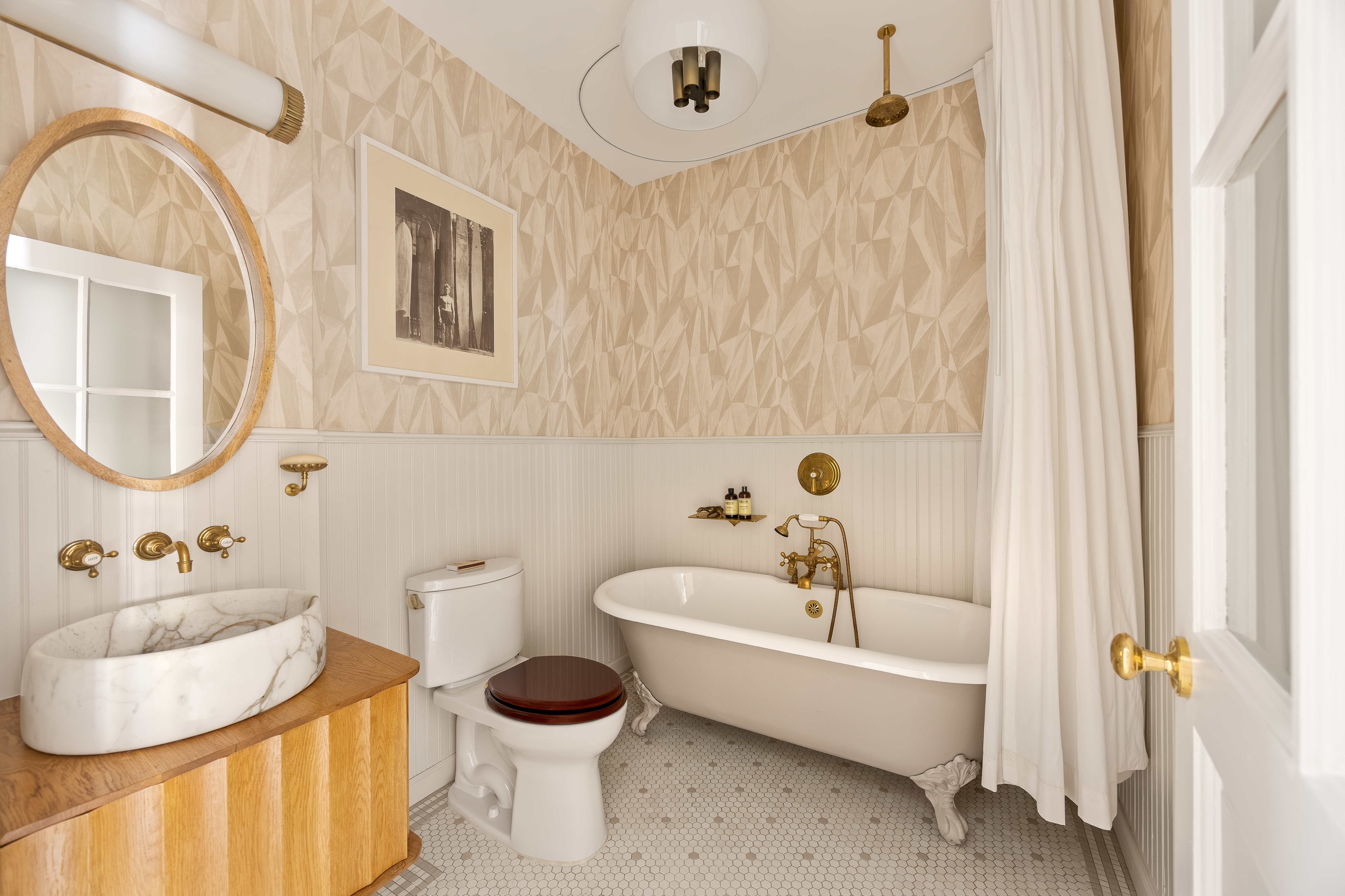 182 Lafayette Street, Unit 5 Manhattan, NY 10013 - Photo 17 of 19 a bathroom with a sink toilet and shower