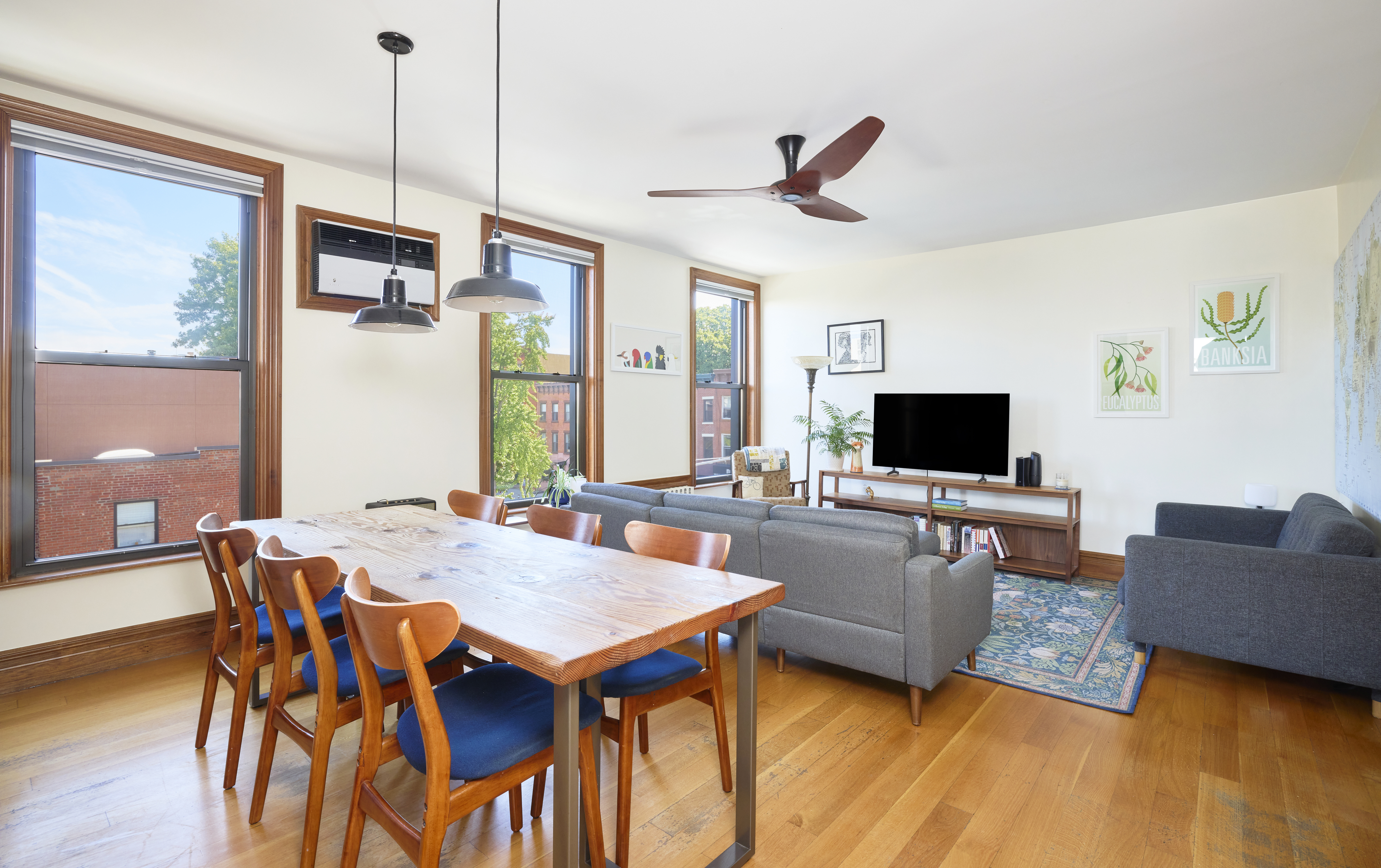 1702 8th Avenue, Unit 3 Brooklyn, NY 11215 - Photo 2 of 15 a view of a livingroom with furniture and a flat screen tv