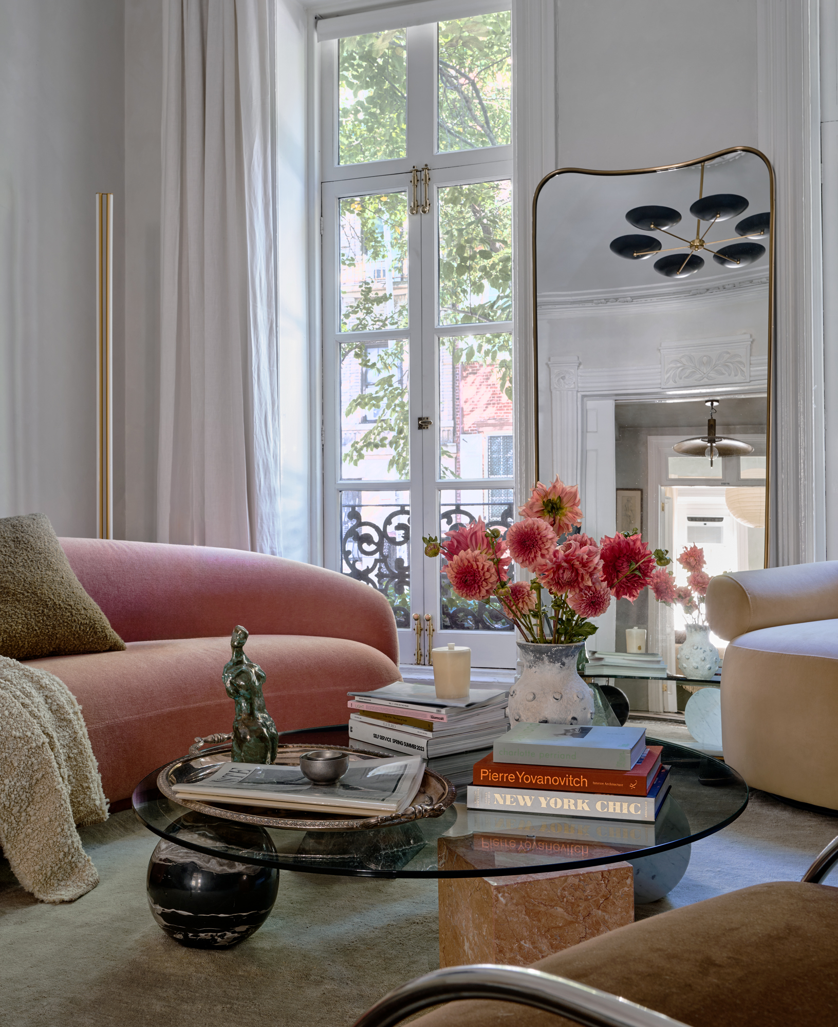 a bedroom with furniture and a chandelier