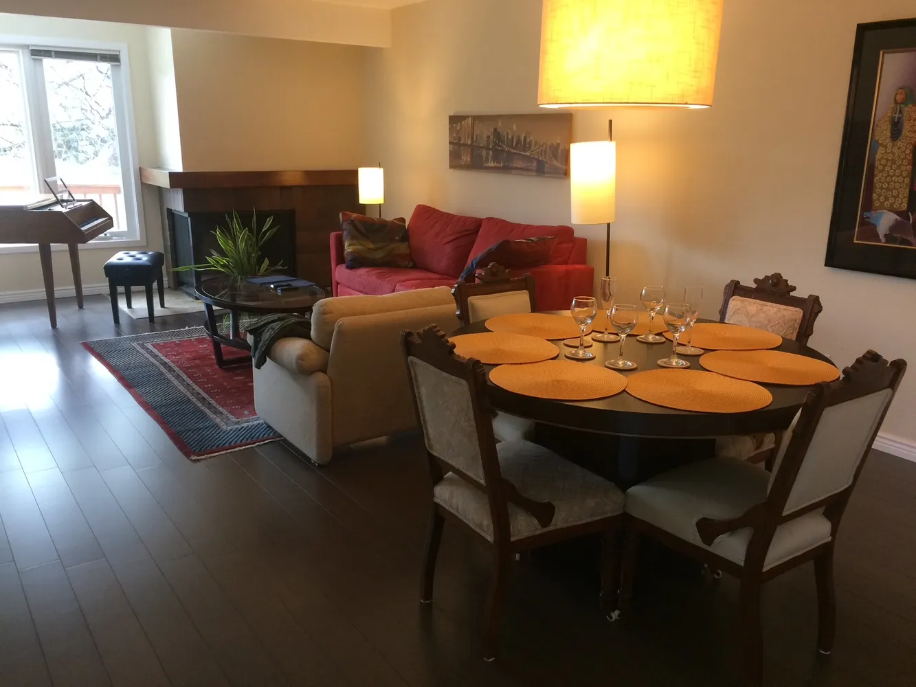 a outdoor dining space with furniture and wooden floor