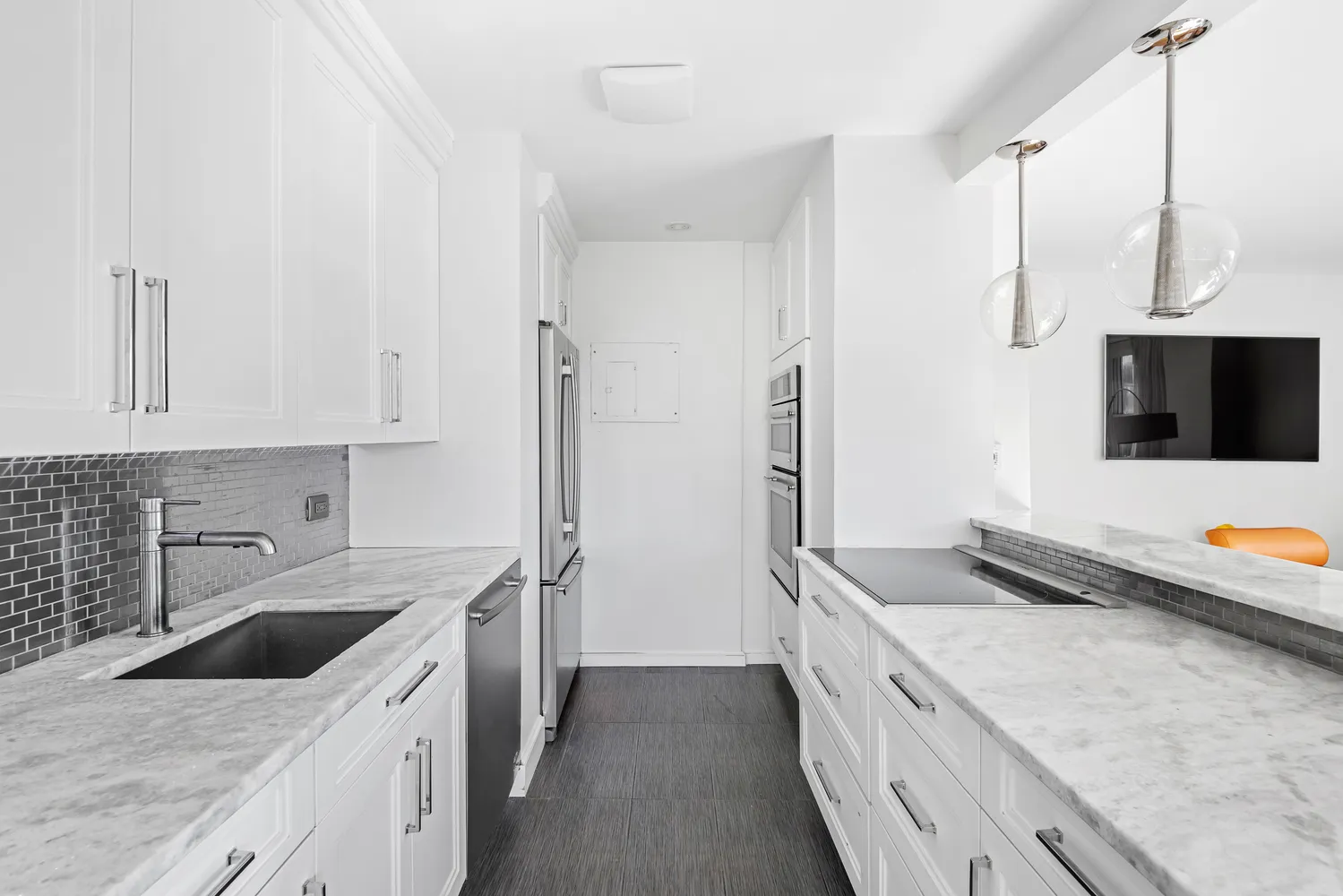 a kitchen with stainless steel appliances granite countertop a sink and a stove
