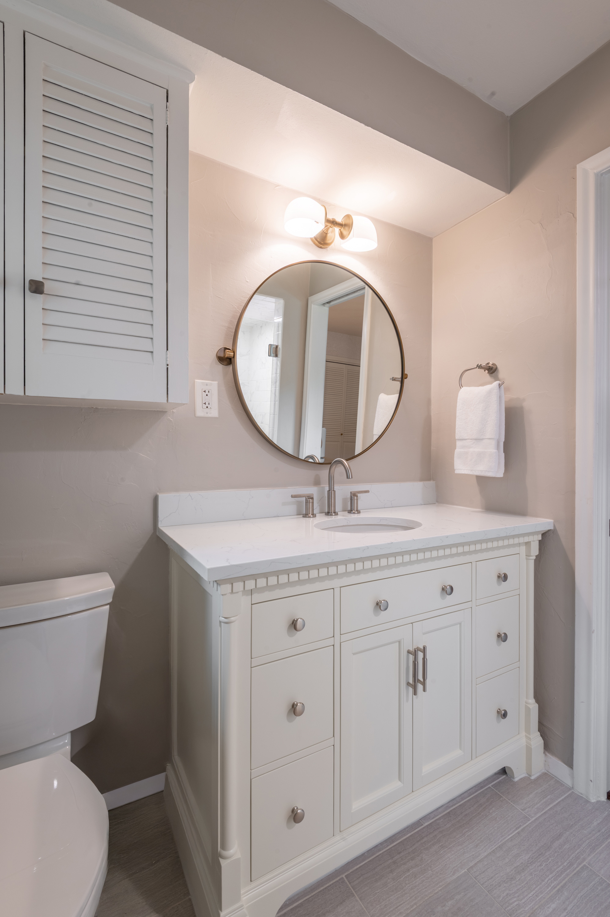 3363 Merrell Road Dallas, TX 75229 - Photo 23 of 29 a bathroom with a granite countertop toilet a sink and a mirror
