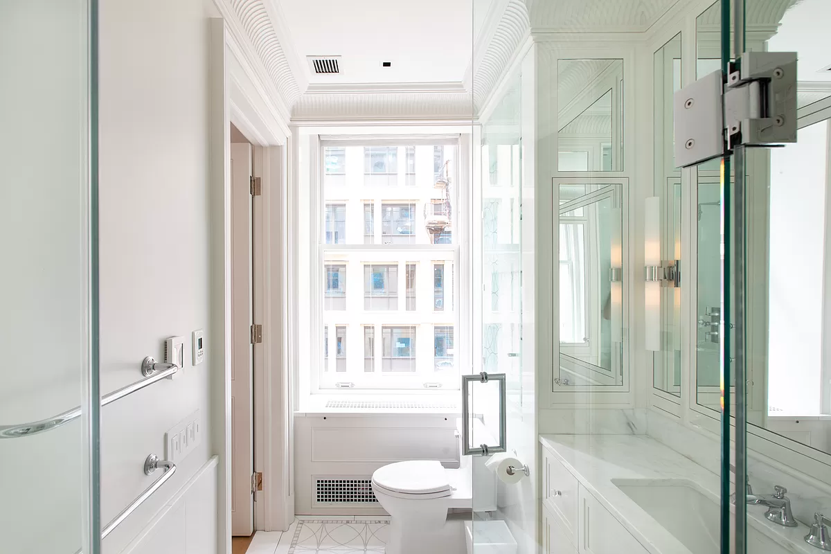 390 West End Avenue, Unit 7DS Manhattan, NY 10024 - Photo 18 of 31 a bathroom with a glass shower door