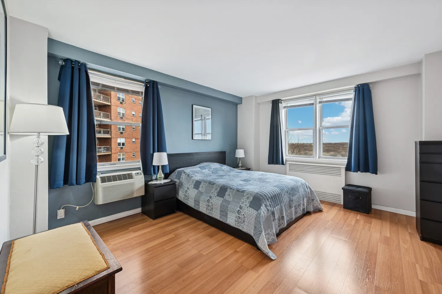 a bedroom with a large bed and a window
