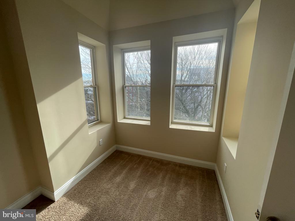 1033 Park Road Northwest, Unit 6 Washington, DC 20010 - Photo 12 of 38 a view of an empty room with a window