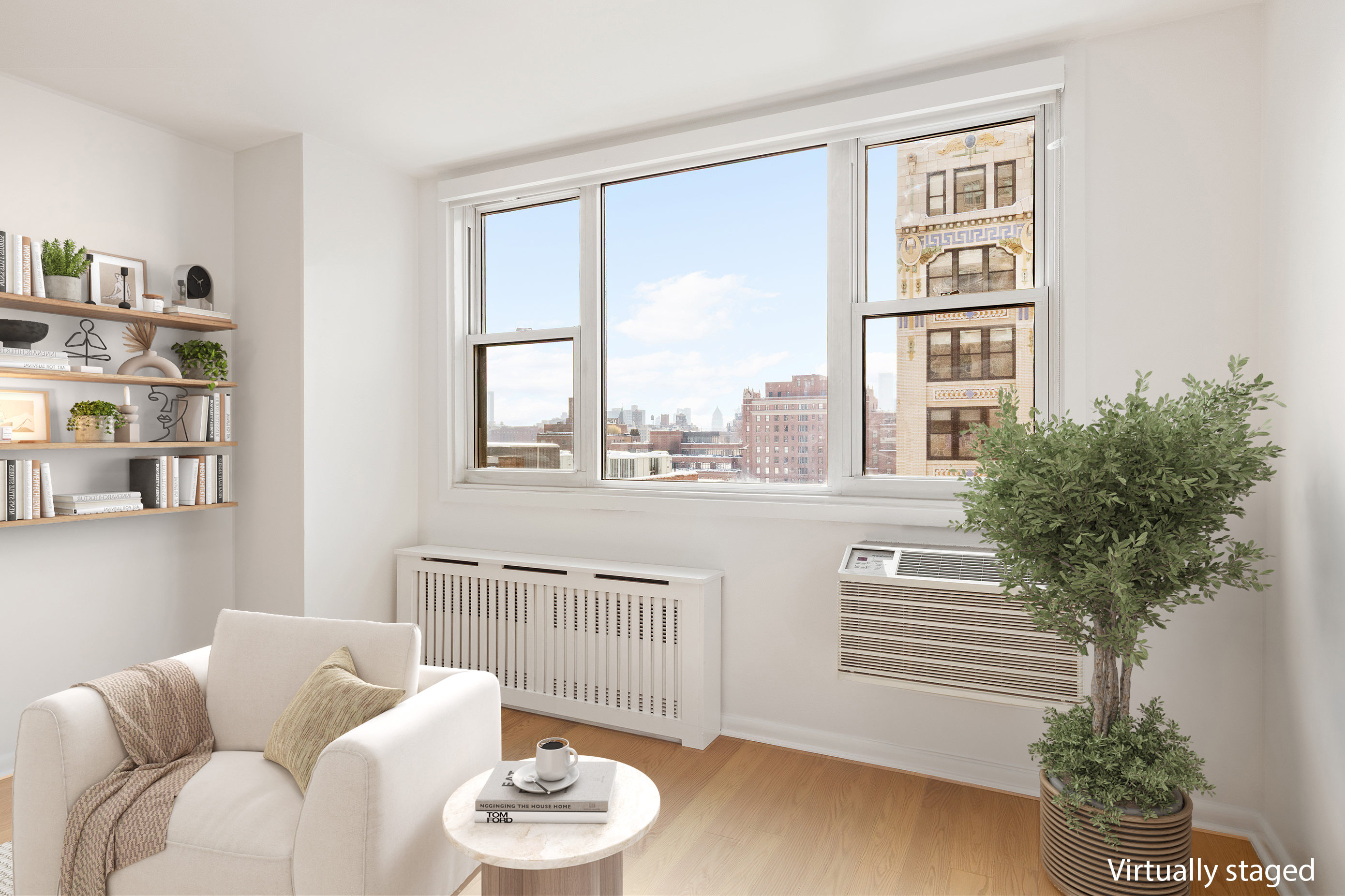 77 7th Avenue, Unit 12P Manhattan, NY 10011 - Photo 3 of 15 a living room with furniture and a potted plant