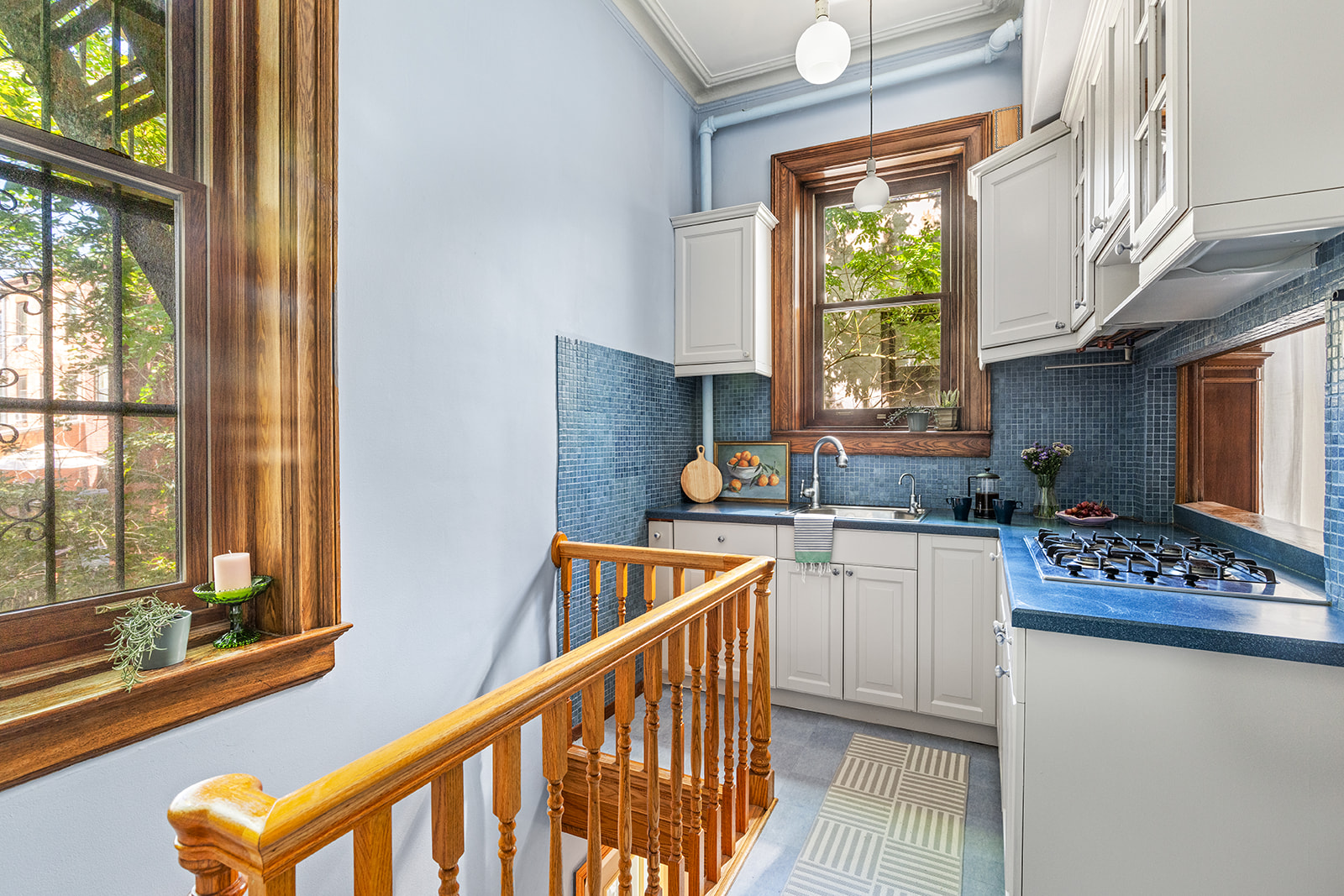 102 Prospect Park West, Unit 2 Brooklyn, NY 11215 - Photo 4 of 12 a kitchen that has a sink a stove and chair