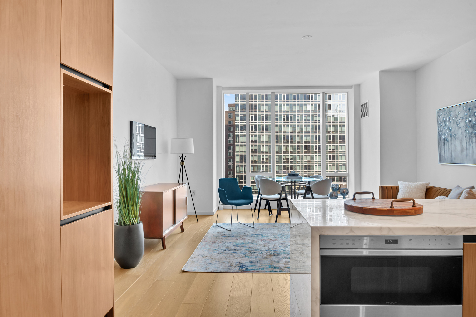 1 West End Avenue, Unit 16L Manhattan, NY 10069 - Photo 9 of 11 a dining hall with stainless steel appliances granite countertop a stove and a sink