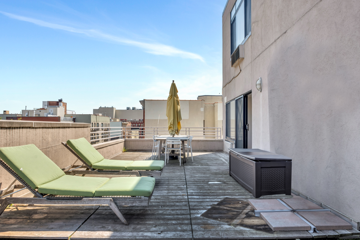 416 East 117th Street, Unit PH6 Manhattan, NY 10035 - Photo 17 of 18 a view of a terrace with chairs