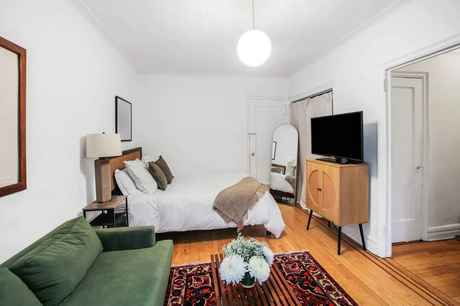 a living room with furniture and a flat screen tv