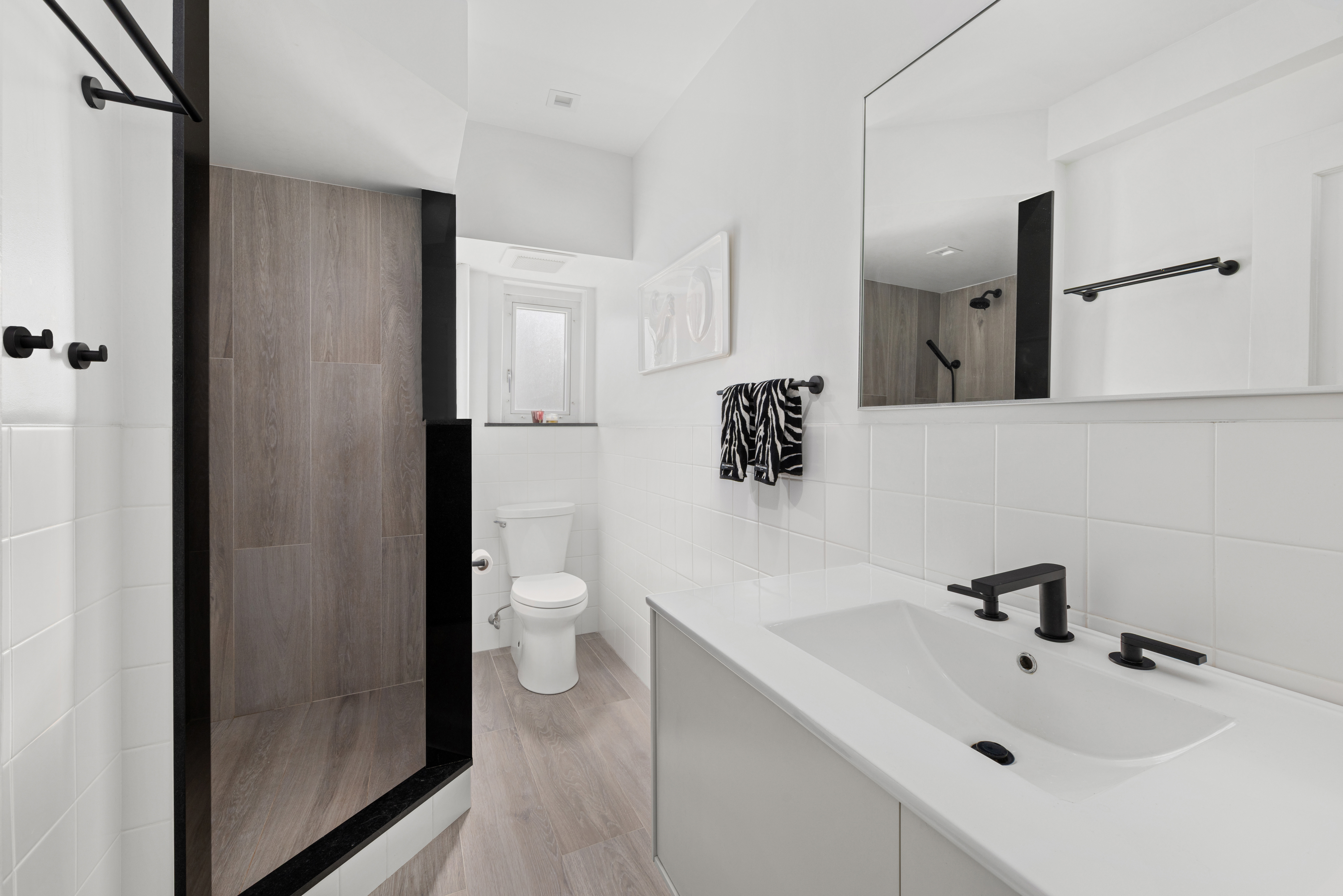 131 Avenue B, Unit 4A Manhattan, NY 10009 - Photo 6 of 11 a bathroom with a sink a toilet and shower