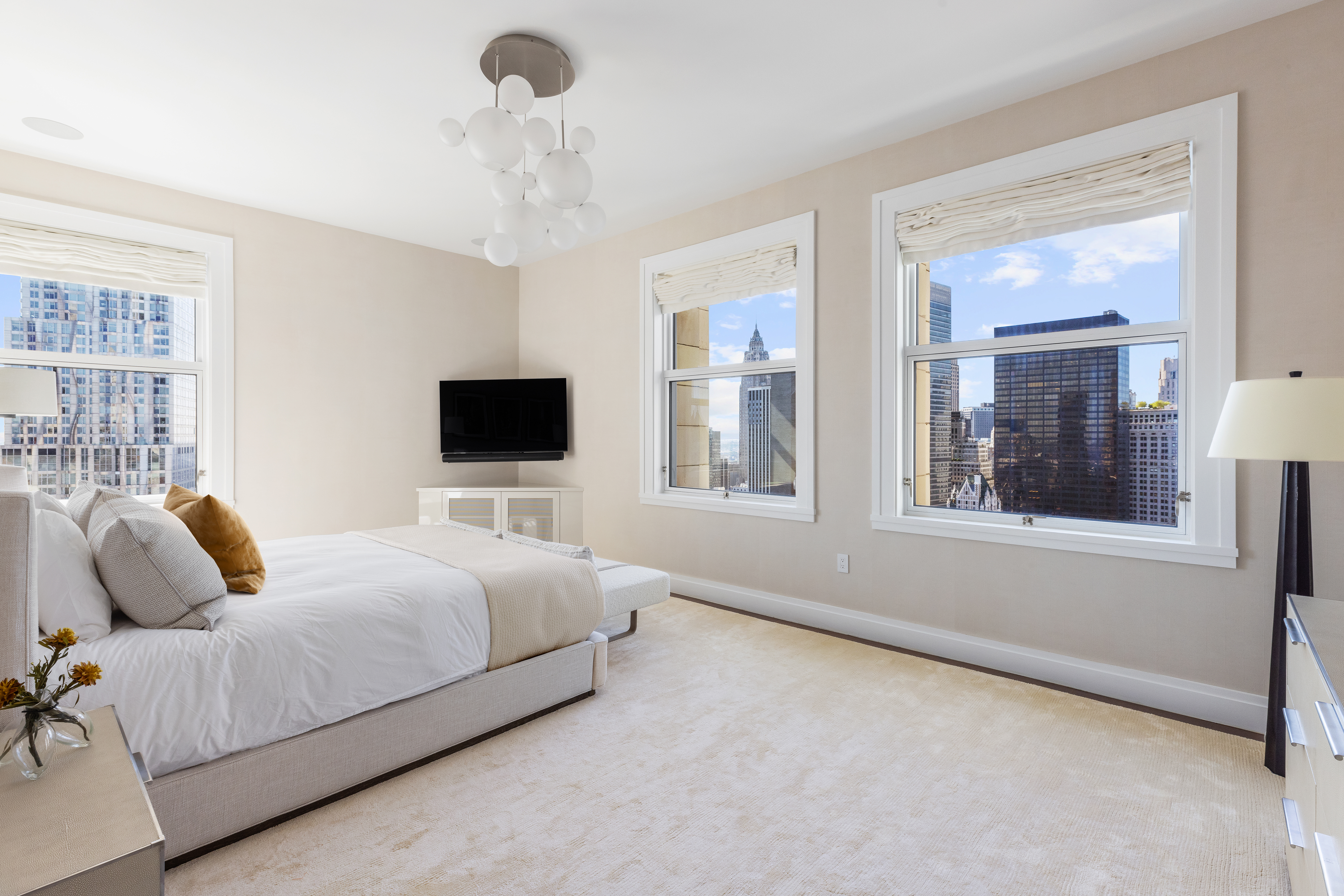 2 Park Place, Unit 35A Manhattan, NY 10007 - Photo 8 of 21 a bedroom with a bed and a flat screen tv