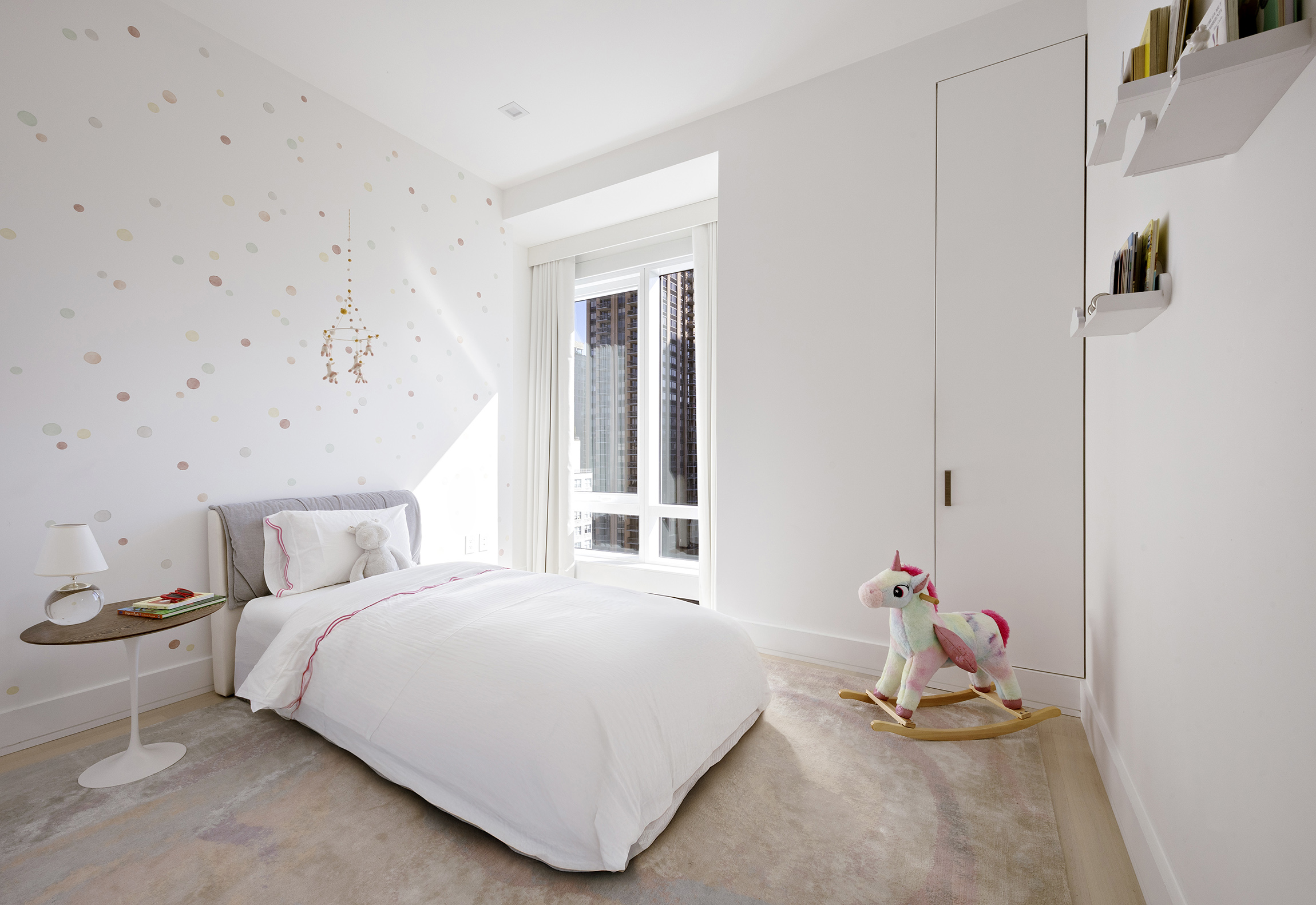 200 Amsterdam Avenue, Unit 17A Manhattan, NY 10023 - Photo 12 of 24 a bedroom with a bed and a window