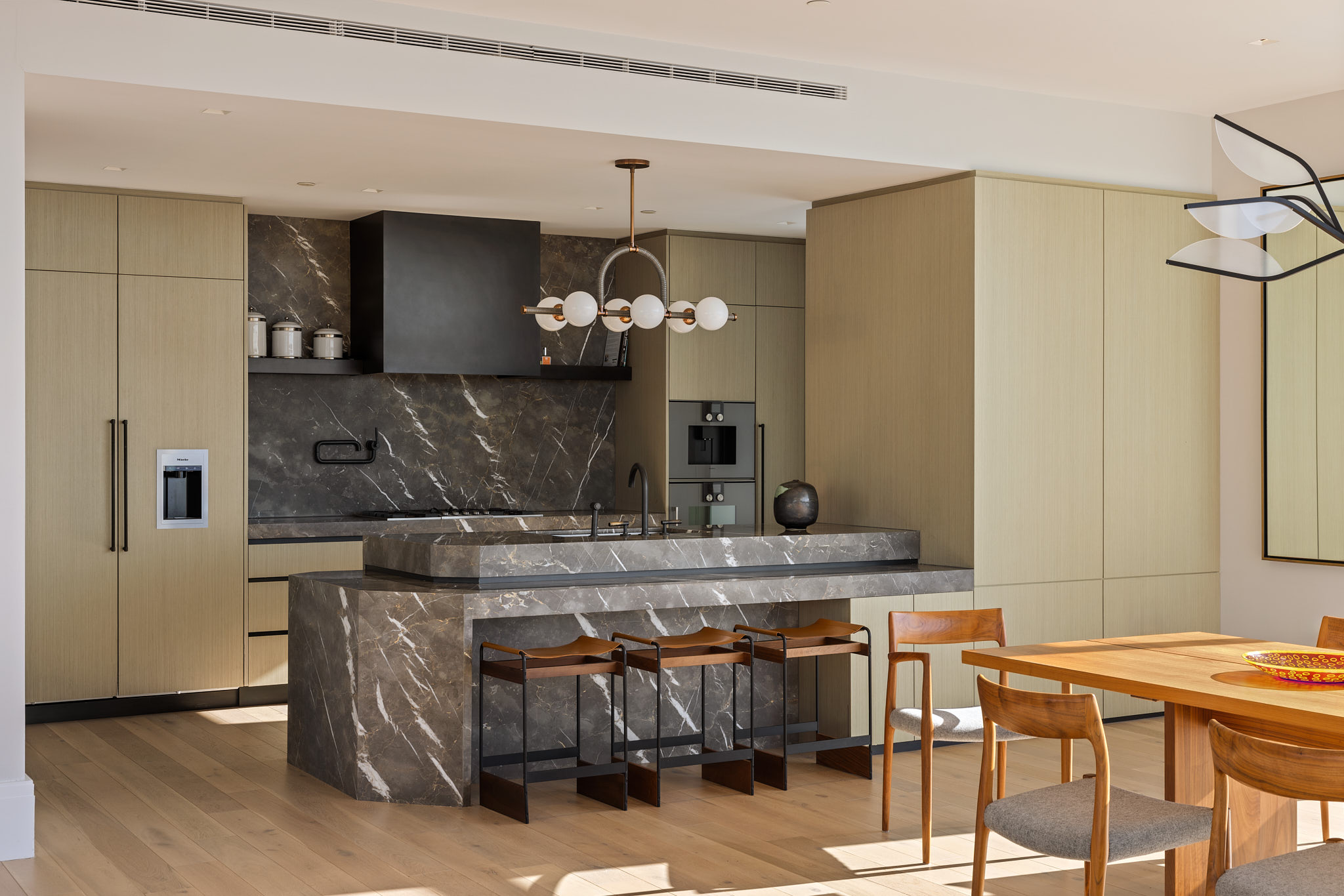 45 East 22nd Street, Unit 52/53B Manhattan, NY 10010 - Photo 3 of 27 a kitchen with a table and chairs in it