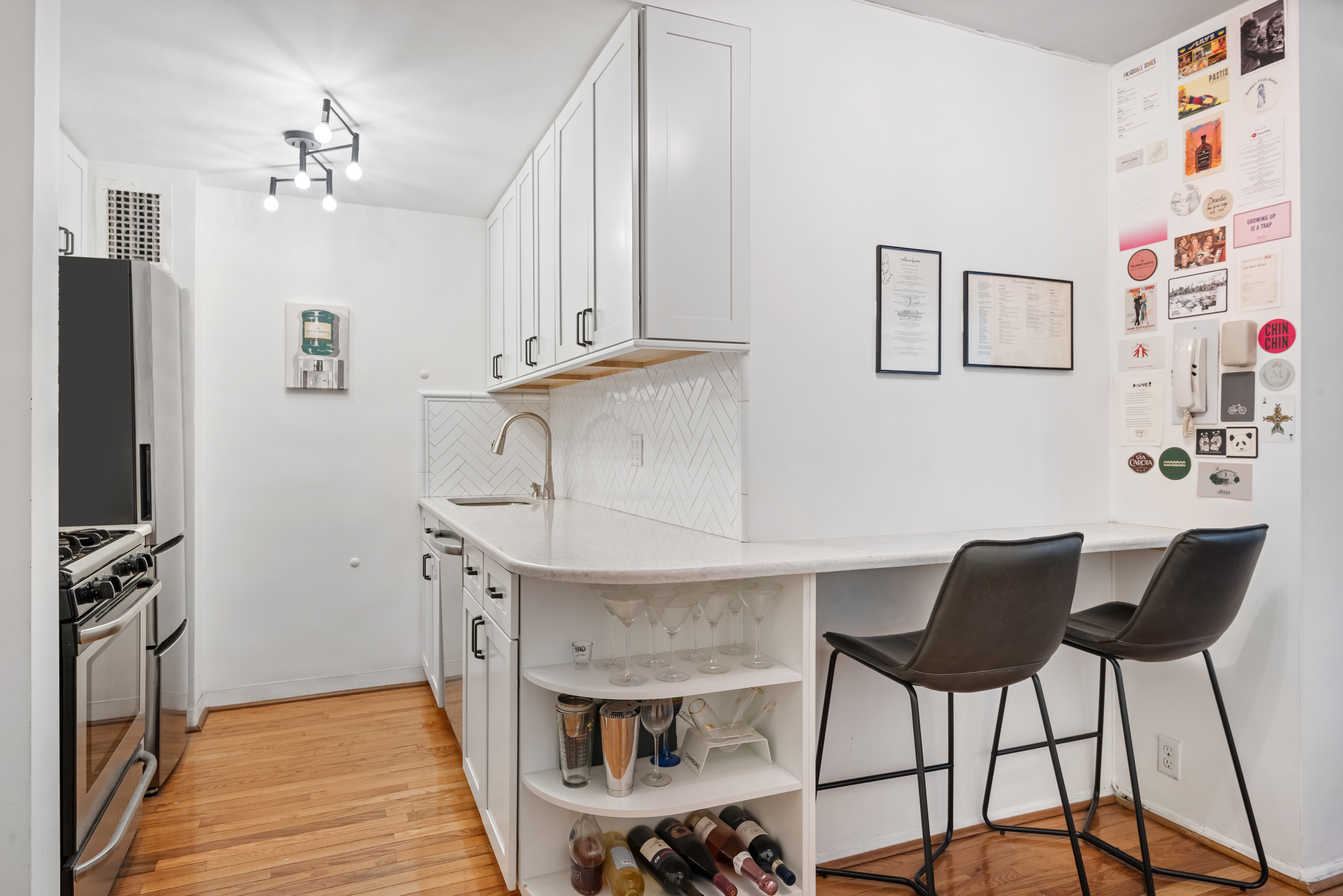 130 East 18th Street, Unit 8R Manhattan, NY 10003 - Photo 4 of 9 a workspace with furniture and chandelier