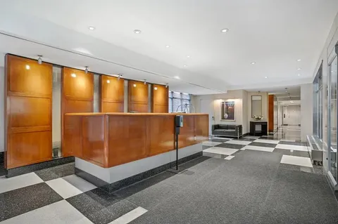 a view of a big room with windows