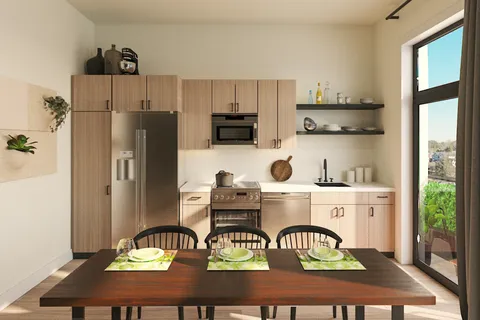 a kitchen with a refrigerator and a stove top oven