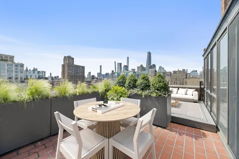 a view of a terrace with sitting area