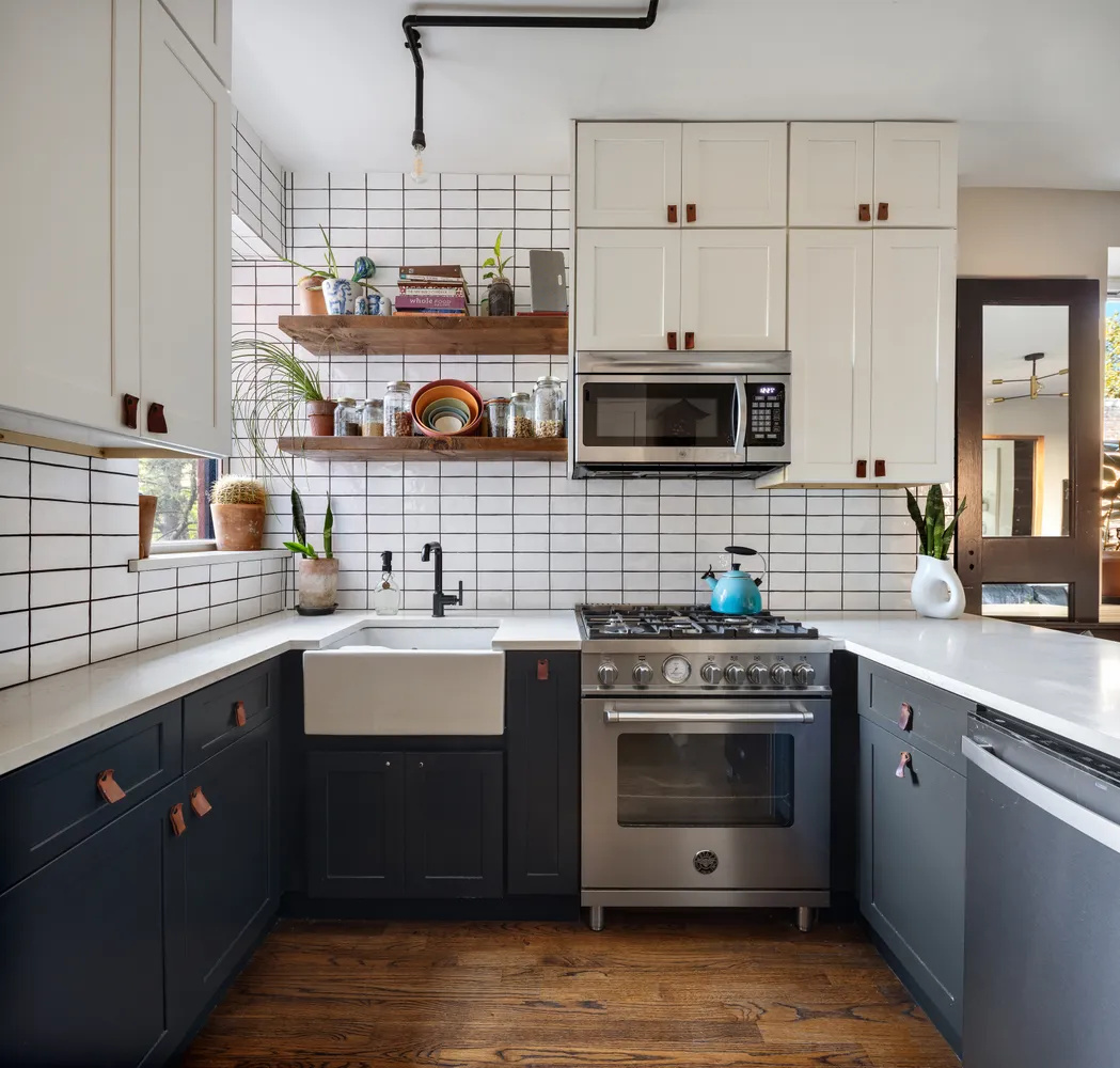 a kitchen with stainless steel appliances a stove sink and cabinets
