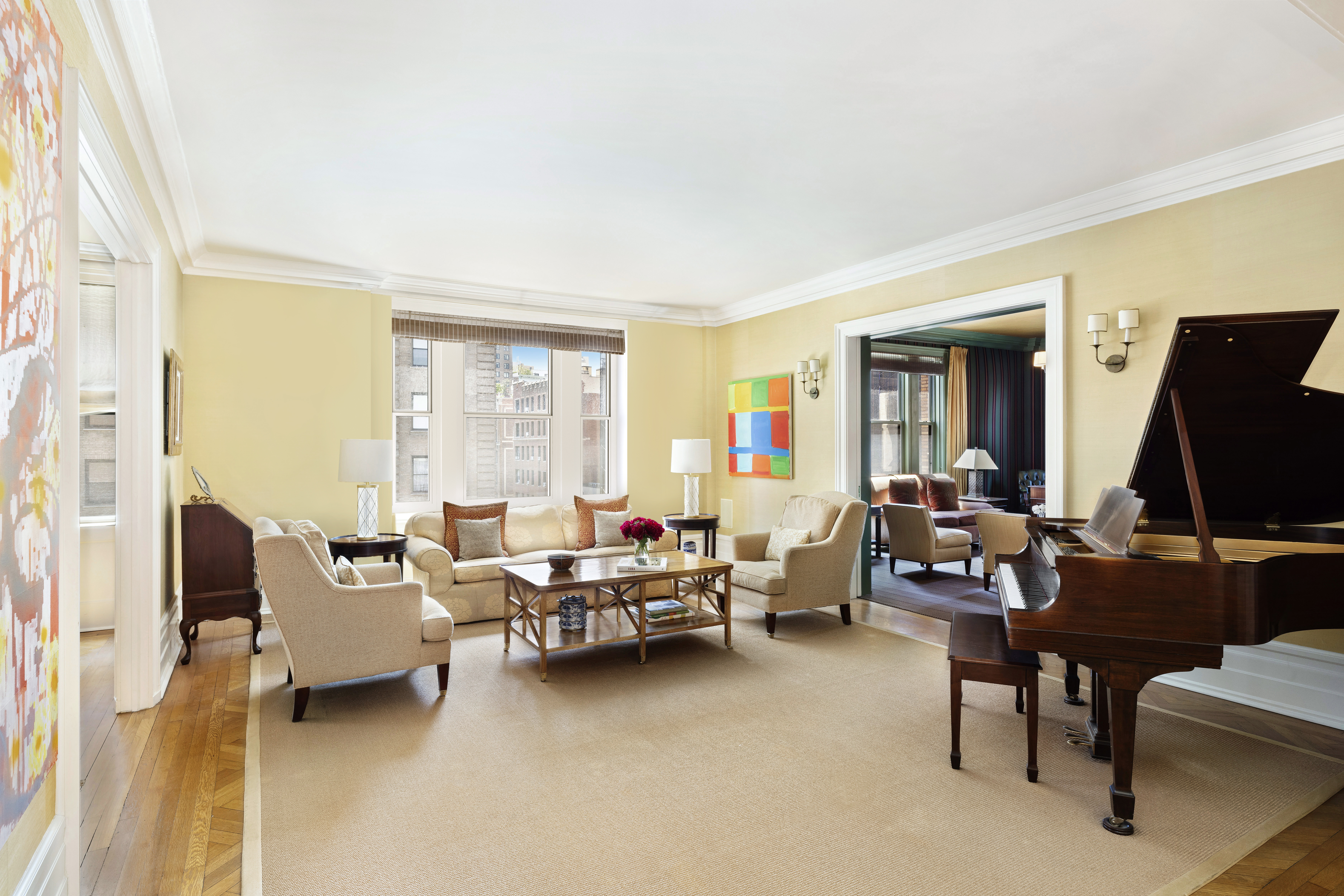 325 West End Avenue, Unit 6AB Manhattan, NY 10023 - Photo 1 of 22 a living room with furniture a window and a flat screen tv