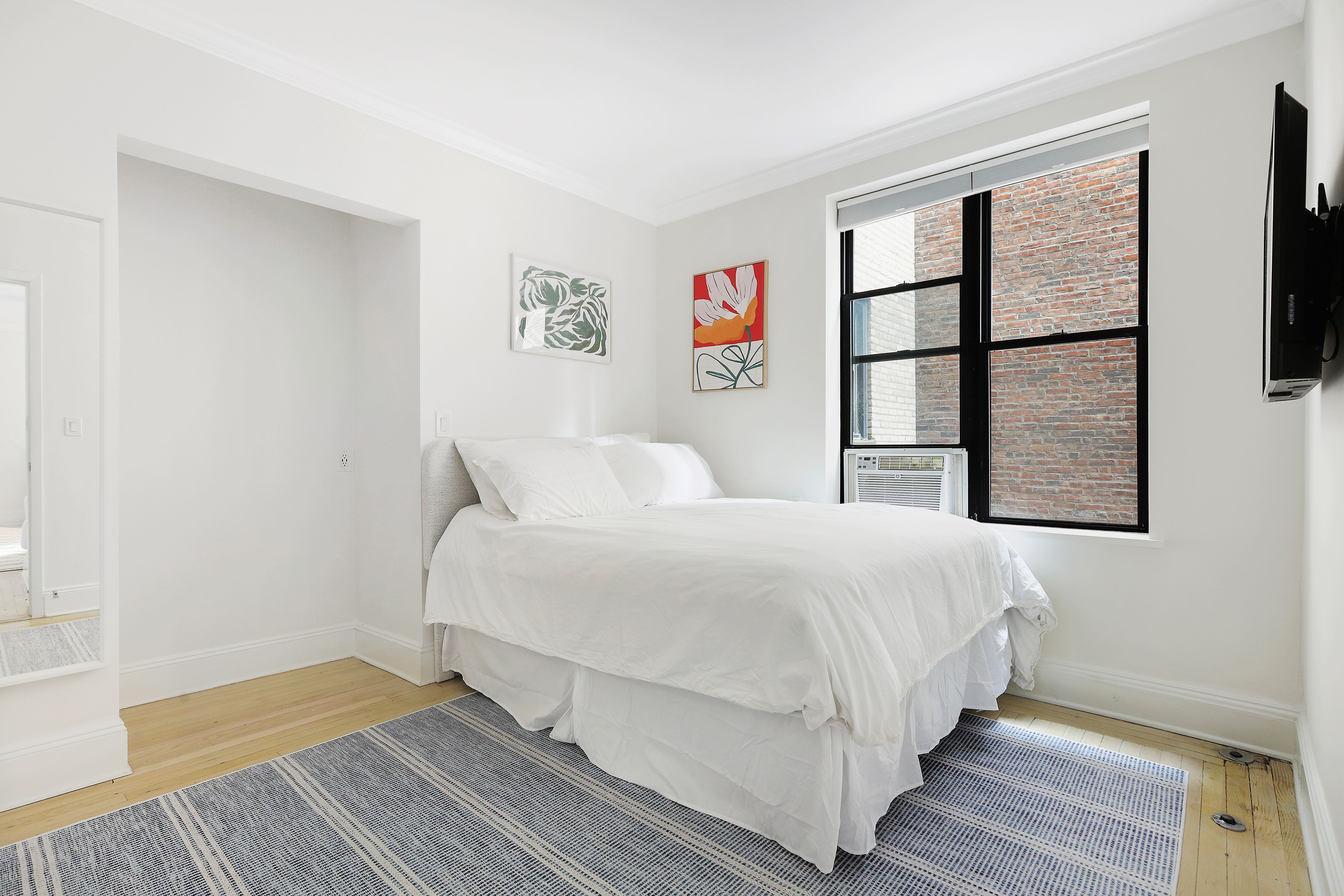 2 Grace Court, Unit 2C Brooklyn, NY 11201 - Photo 4 of 15 a bedroom with a bed and a window