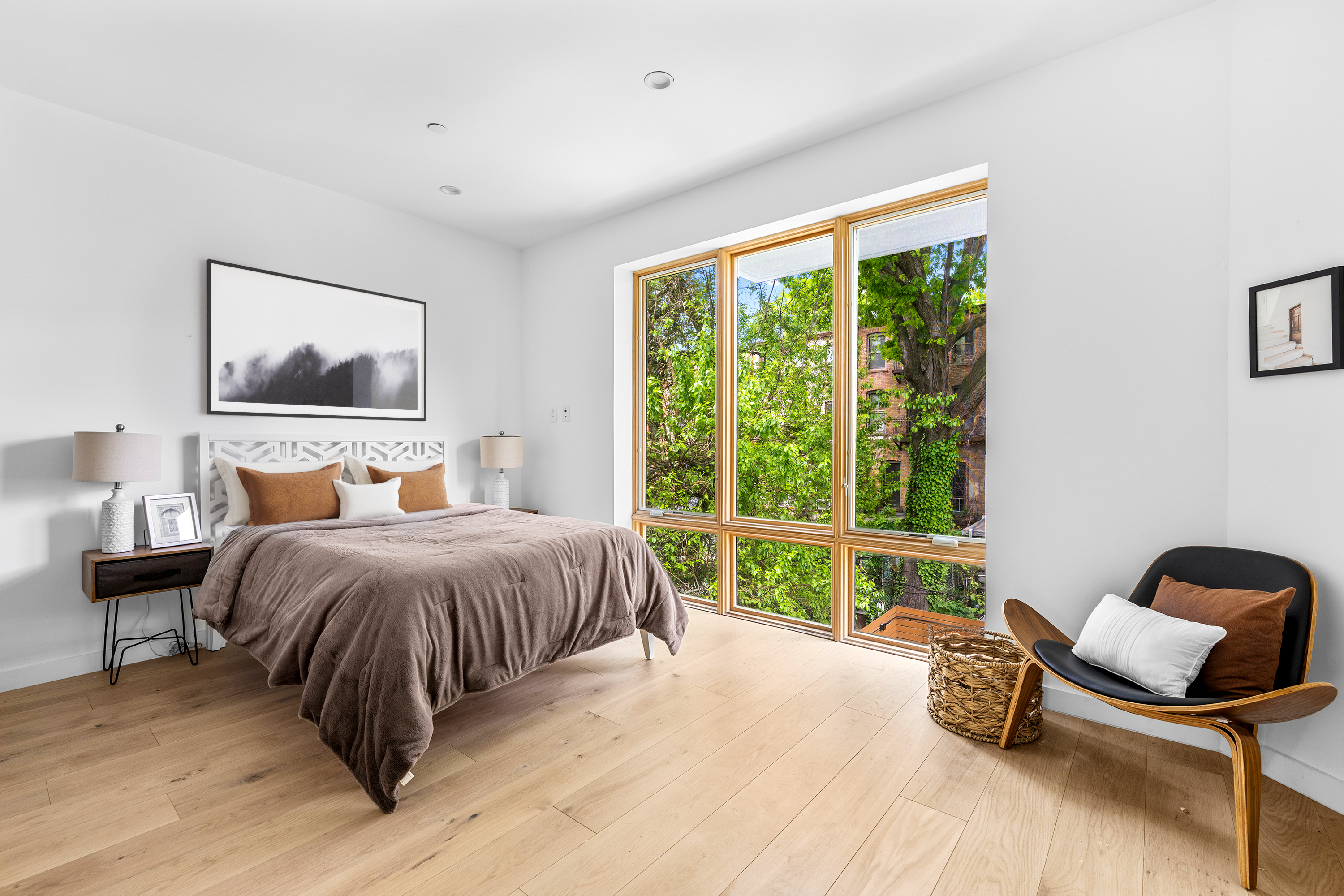 545 Lexington Avenue, Unit 1 Brooklyn, NY 11221 - Photo 4 of 19 a bedroom with a bed and a large window