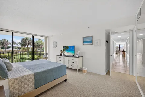 a view of workspace with wooden floor windows cabinet