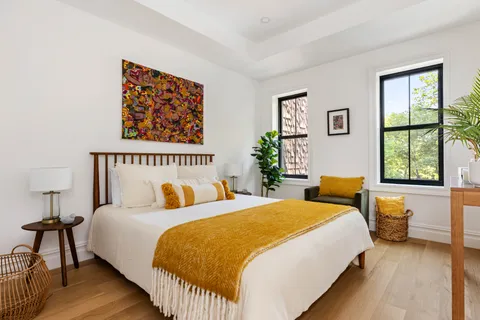 a bedroom with bed and a window